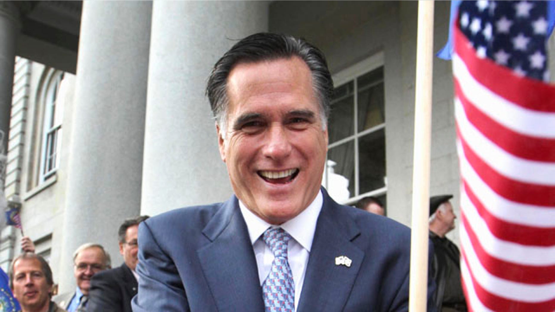 FILE - In this Oct. 24, 2011 file photo, Republican presidential candidate, former Massachusetts Gov. Mitt Romney greets supporters outside the State House in Concord, N.H. (AP Photo/Jim Cole, File)