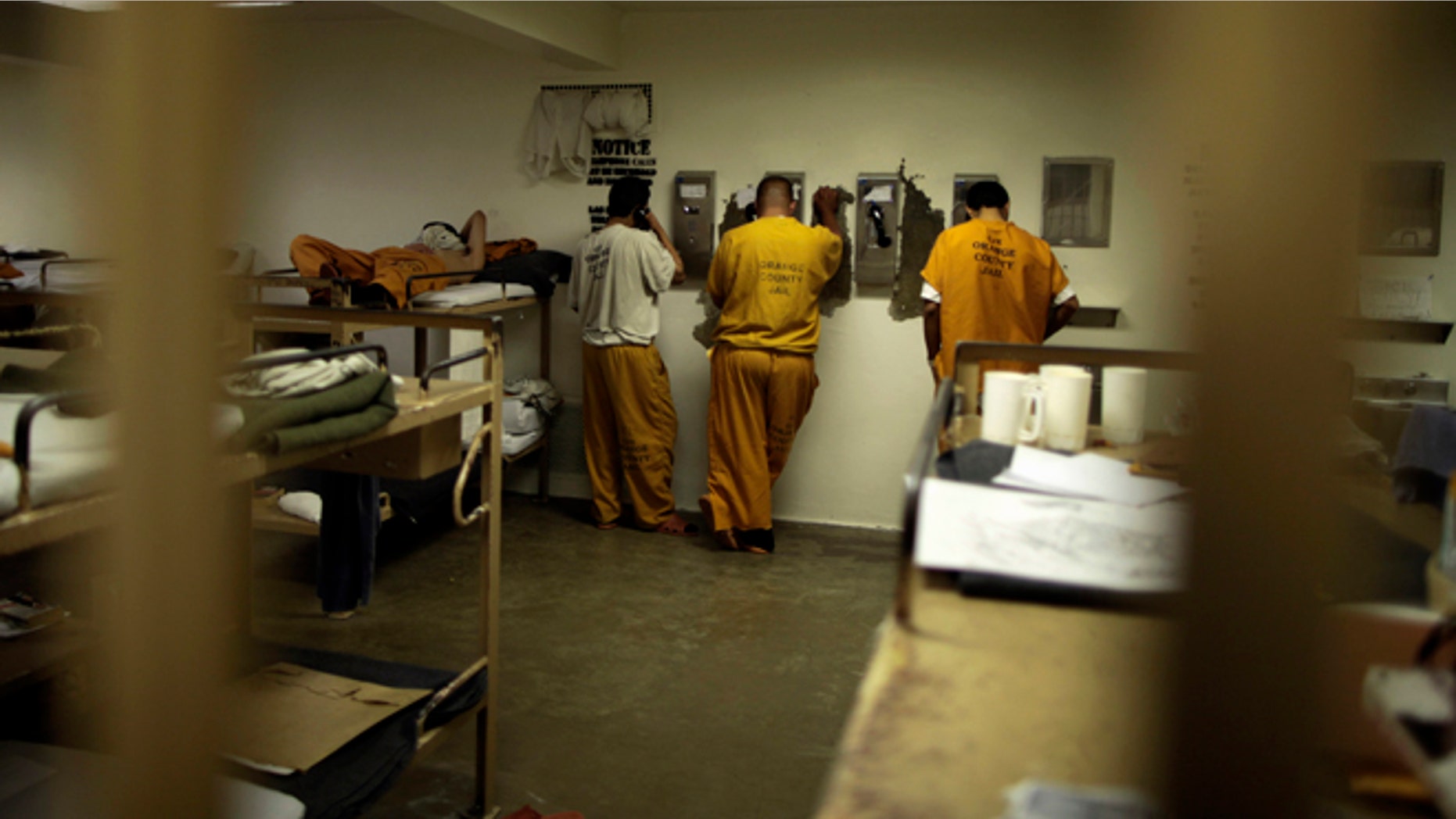 May 24, 2011: Inmates make phone calls from their cell at a county jail in Santa Ana, Calif.