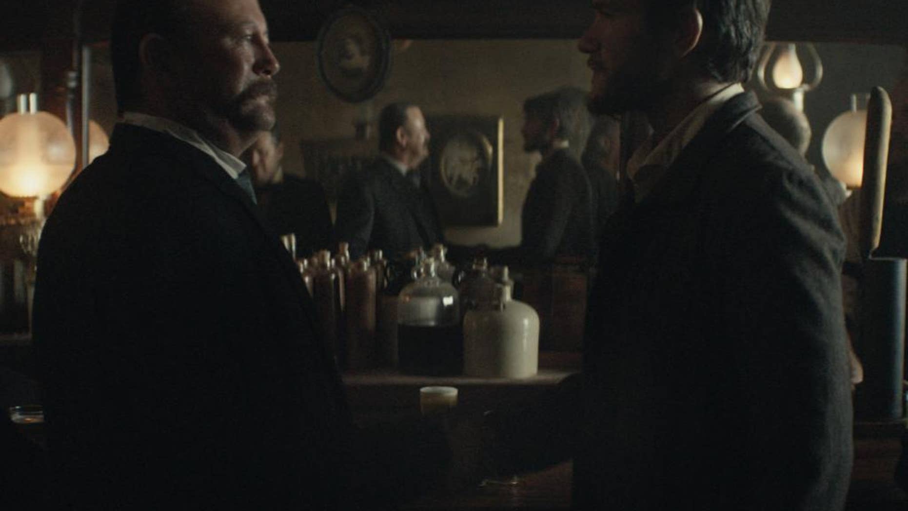 This photo provided by Budweiser shows a scene from the company's spot for Super Bowl 51, between the New England Patriots and Atlanta Falcons, Sunday, Feb. 5, 2017. The scene depicts when Anheuser-Busch co-founder Adolphus Busch, right, after traveling by boat from Germany, met fellow immigrant Eberhard Anheuser. (Budweiser via AP)
