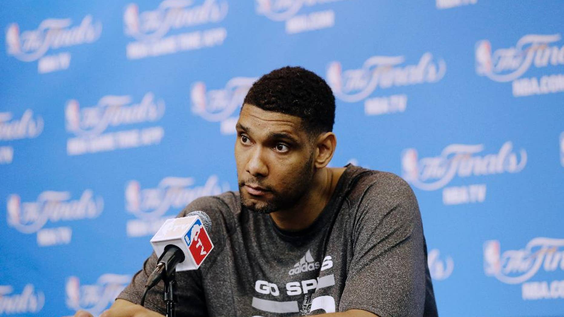 San Antonio Spurs forward Tim Duncan listens to a question during a news conference on Saturday, June 7, 2014, in San Antonio. The team plays Game 2 of the NBA Finals against the Miami Heat on Sunday. (AP Photo/Eric Gay)