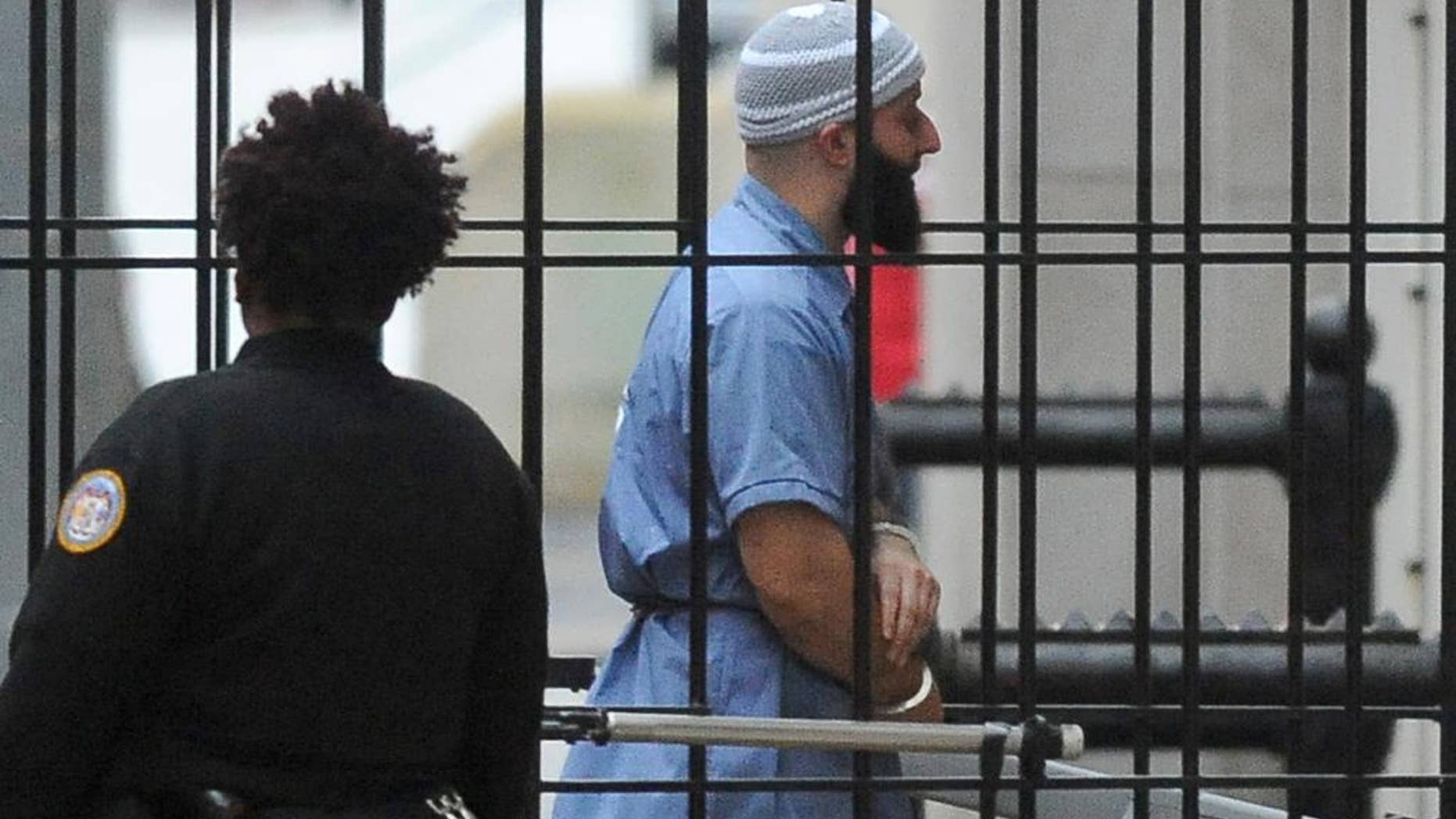 FILE - In a Wednesday, Feb. 3, 2016 file photo, Adnan Syed enters Courthouse East in Baltimore prior to a hearing. The hearing, scheduled to last three days before Baltimore Circuit Judge Martin Welch, is meant to determine whether Syed's conviction will be overturned and case retried. After spending 16 years in prison, Syed, convicted of murder, who was at the center of the podcast "Serial" has won a new trial in Baltimore. Baltimore Circuit Judge Martin Welch ruled Thursday, June 30, 2016, that Syed deserves another trial because his attorney failed to cross-examine a cell tower expert about the reliability of data. (Barbara Haddock Taylor/The Baltimore Sun via AP, File) WASHINGTON EXAMINER OUT; MANDATORY CREDIT /The Baltimore Sun via AP) WASHINGTON EXAMINER OUT; MANDATORY CREDIT