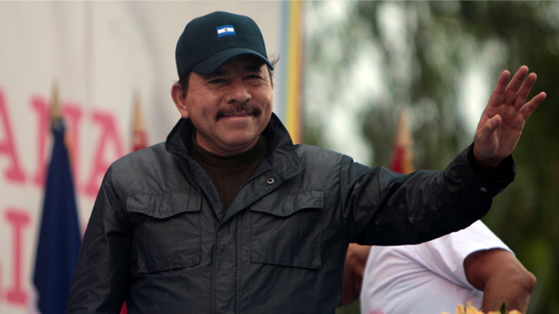 Nicaragua's President Daniel Ortega waves to supporters during an event marking the 32nd anniversary of the Sandinista's withdrawal to Masaya, in Managua, Nicaragua. (AP Photo/Esteban Felix, File)