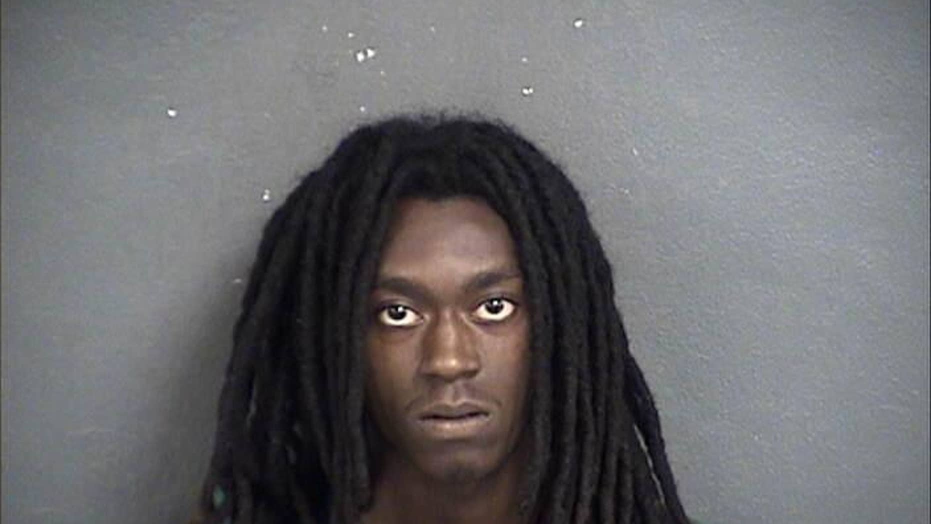 This photo provided by the Wyandotte County, Kan., Sheriff’s Department shows Jamaal R. Lewis of Kansas City, Kan. Lewis was charged Thursday, July 21, 2016, with capital murder in the death Tuesday of 46-year-old Kansas City, Kan., police Capt. Robert D. Melton. (Wyandotte County, Kan., Sheriff’s Department via AP)