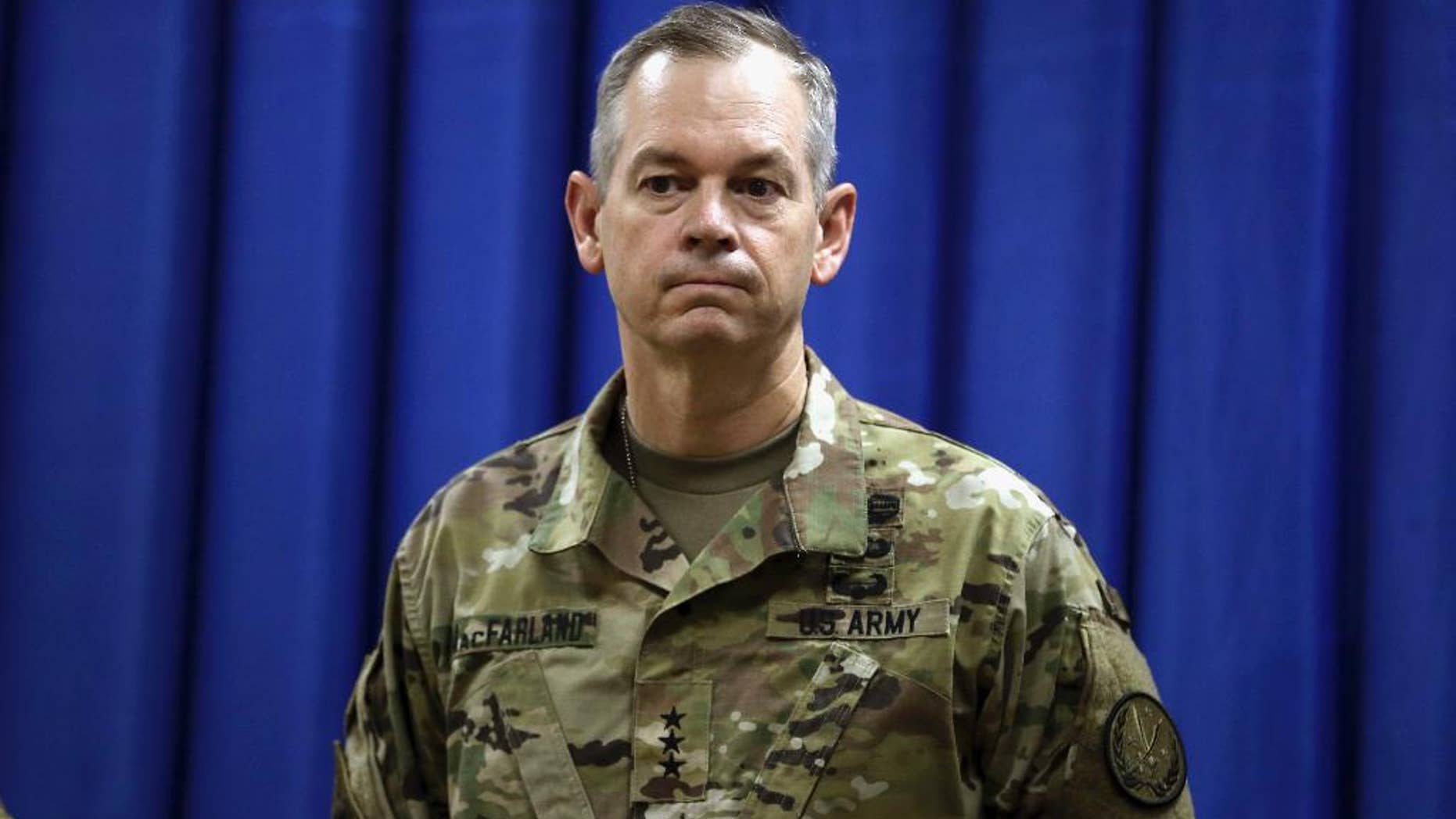 FILE - In this Oct. 1, 2015, file photo, Lt. Gen. Sean MacFarland, the new commander general of the U.S. led coalition in Iraq, attends a news conference at the U.S. Embassy in the heavily fortified Green Zone in Baghdad, Iraq. The military campaigns in Iraq and Syria have taken 45,000 enemy combatants off the battlefield, and reduced the total number of Islamic State fighters to as few as 15,000, the top U.S. commander for the fight against IS said Aug. 10, 2016. MacFarland said that both the number and quality of IS fighters is declining and warned that it is difficult to determine accurate numbers. (AP Photo/Khalid Mohammed, File)