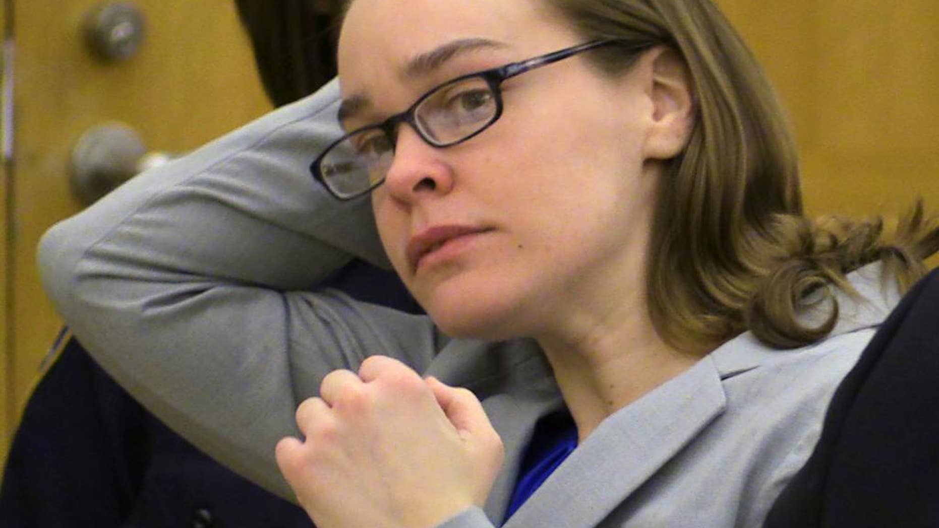 FILE - Defendant Lacey Spears brushes her hair back during the opening statements portion of her murder trial at the Westchester County Courthouse in White Plains, N.Y., in this Feb. 3, 2015 file photo. Summations are scheduled Thursday Feb. 26, 2015 in the case of Lacey Spears, who is charged with murder and manslaughter in the 2014 death of 5-year-old Garnett-Paul Spears. (AP Photo/The Journal-News, Joe Larese, File, Pool)