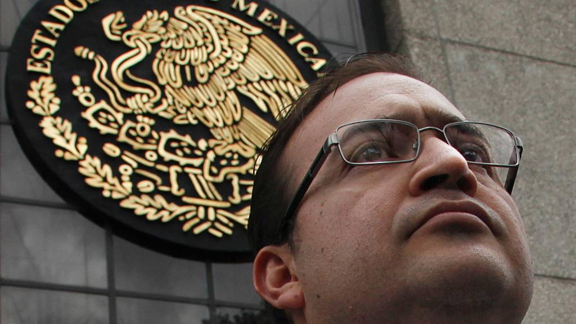 FILE - In this Aug. 5, 2016, file photo, Veracruz Gov. Javier Duarte stands outside the Attorney General's headquarters in Mexico City. The Institutional Revolutionary Party’s national justice committee said in a statement Monday, Sept. 26, that it removed the party rights of Veracruz Gov. Duarte and six other party members. Duarte is under federal investigation for corruption. (AP Photo/Marco Ugarte,File)