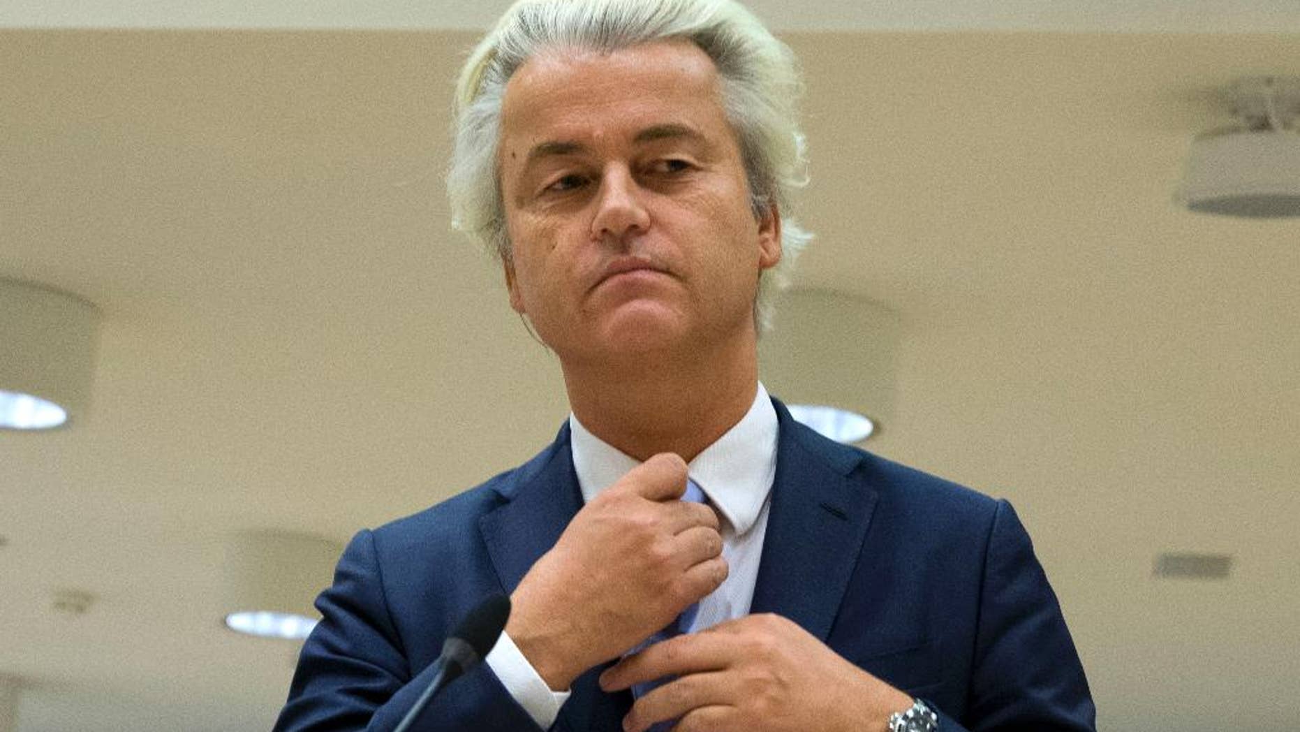 FILE - In this Wednesday, Nov. 23, 2016 file photo populist anti-Islam lawmaker Geert Wilders prepares to address judges at the high-security court near Schiphol Airport, Amsterdam. Judges are set to deliver their verdicts in the politically charged hate speech trial of Dutch anti-Islam lawmaker Geert Wilders. (AP Photo/Peter Dejong)