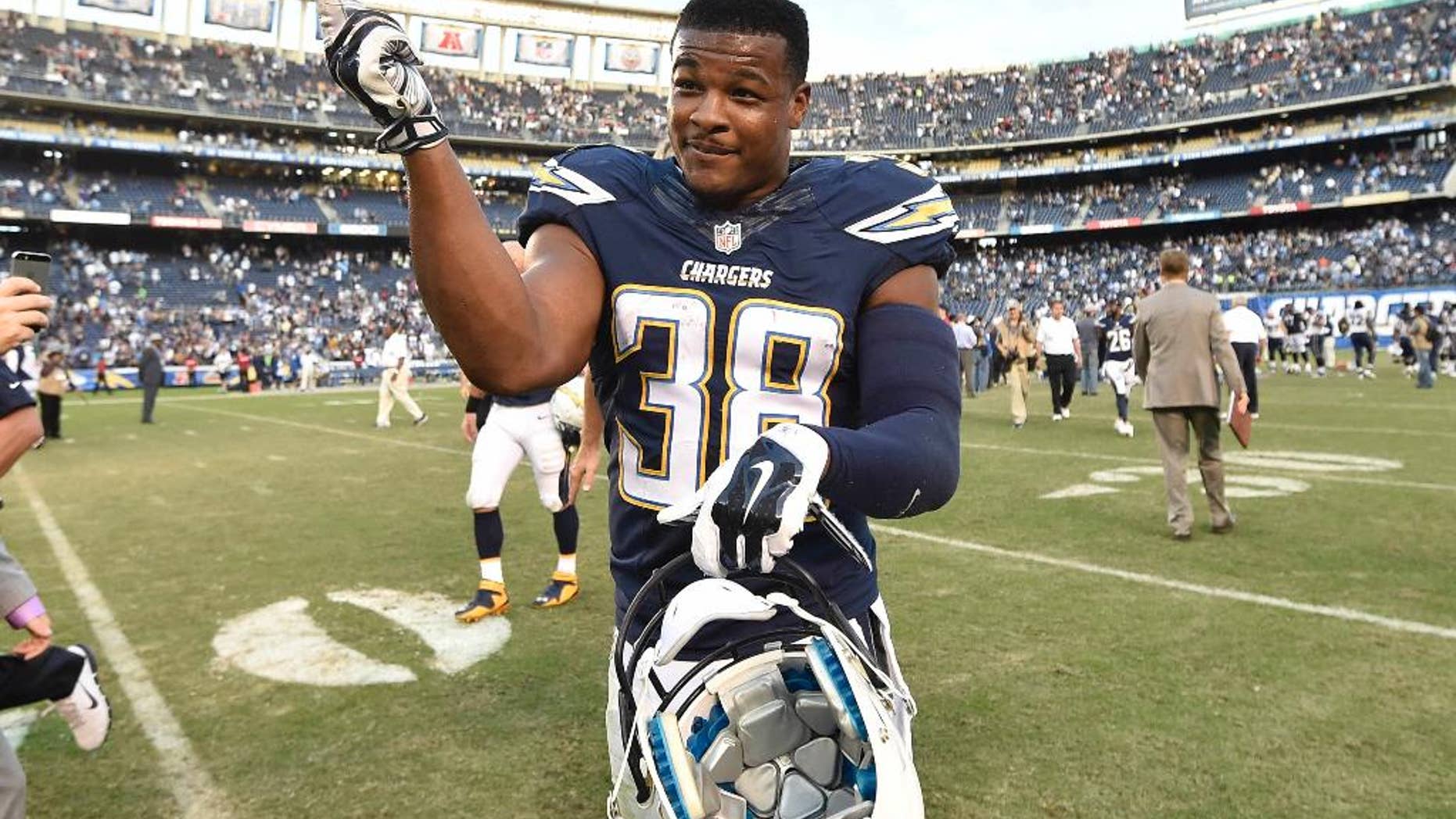 San Diego Chargers strong safety Marcus Gilchrist (38) celebrates on the field after the Chargers defeated the St. Louis Rams 27-24 in an NFL football game, Sunday, Nov. 23, 2014, in San Diego. (AP Photo/Denis Poroy)