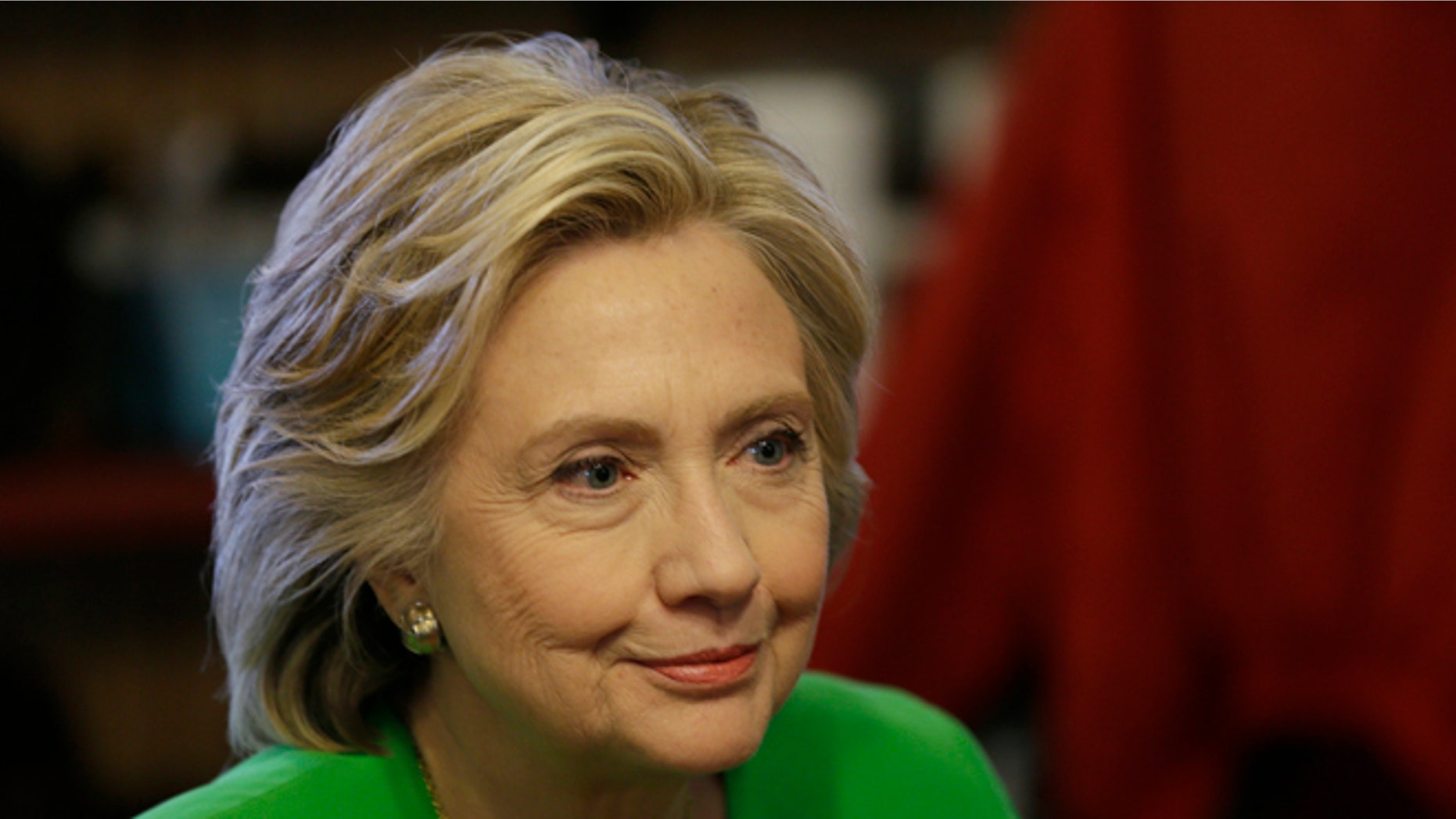 Democratic presidential candidate Hillary Rodham Clinton meets with local residents at the Jones St. Java House, Tuesday, April 14, 2015, in LeClaire, Iowa. (AP Photo/Charlie Neibergall)