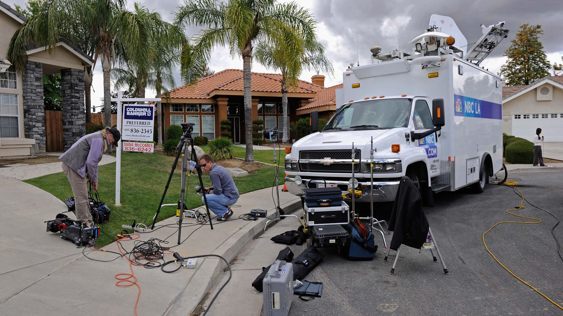 BAKERSFIELD, CA - MAY 18: News media trucks parked on a residential street wait outside the home of Mildred Patricia Baena, former household staff member who mothered a child with former California Governor Arnold Schwarzenegger, on May 18, 2011 in Bakersfield, California. (Photo by Kevork Djansezian/Getty Images)