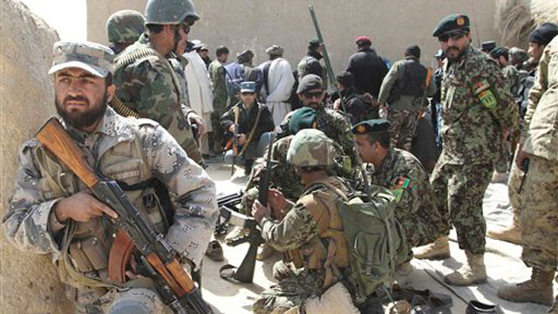 March 13, 2012: Afghan security forces are seen after Taliban militants opened fire on a delegation of senior Afghan officials in Panjwai, Kandahar province south of Kabul, Afghanistan.