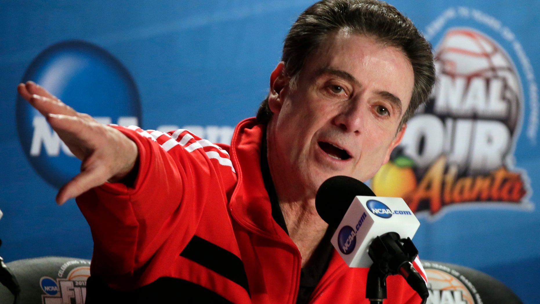 Louisville head coach Rick Pitino answers a question during a news conference for their NCAA Final Four tournament college basketball game Sunday, April 7, 2013, in Atlanta. Louisville plays Michigan in the championship game on Monday. (AP Photo/Chris O'Meara)
