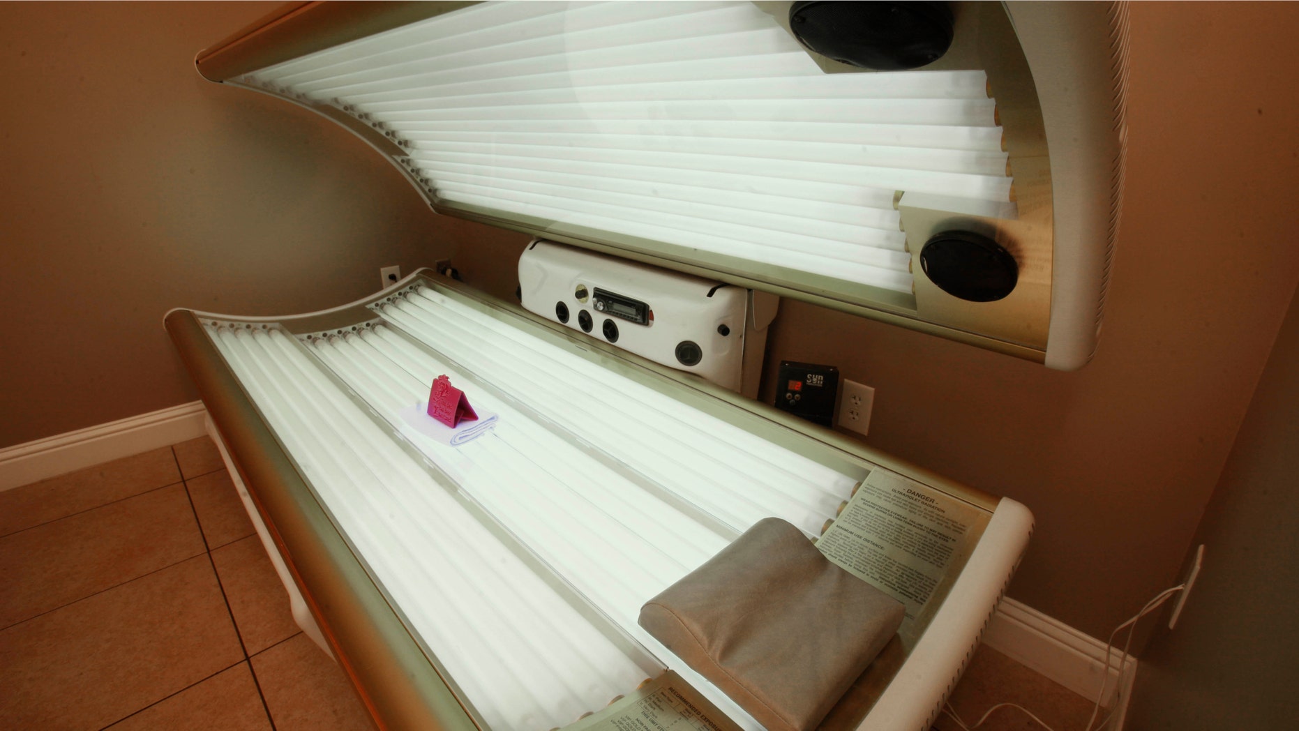 This Dec. 9, 2011 file photo shows an open tanning booth at Amazing Tans in Sacramento, Calif.