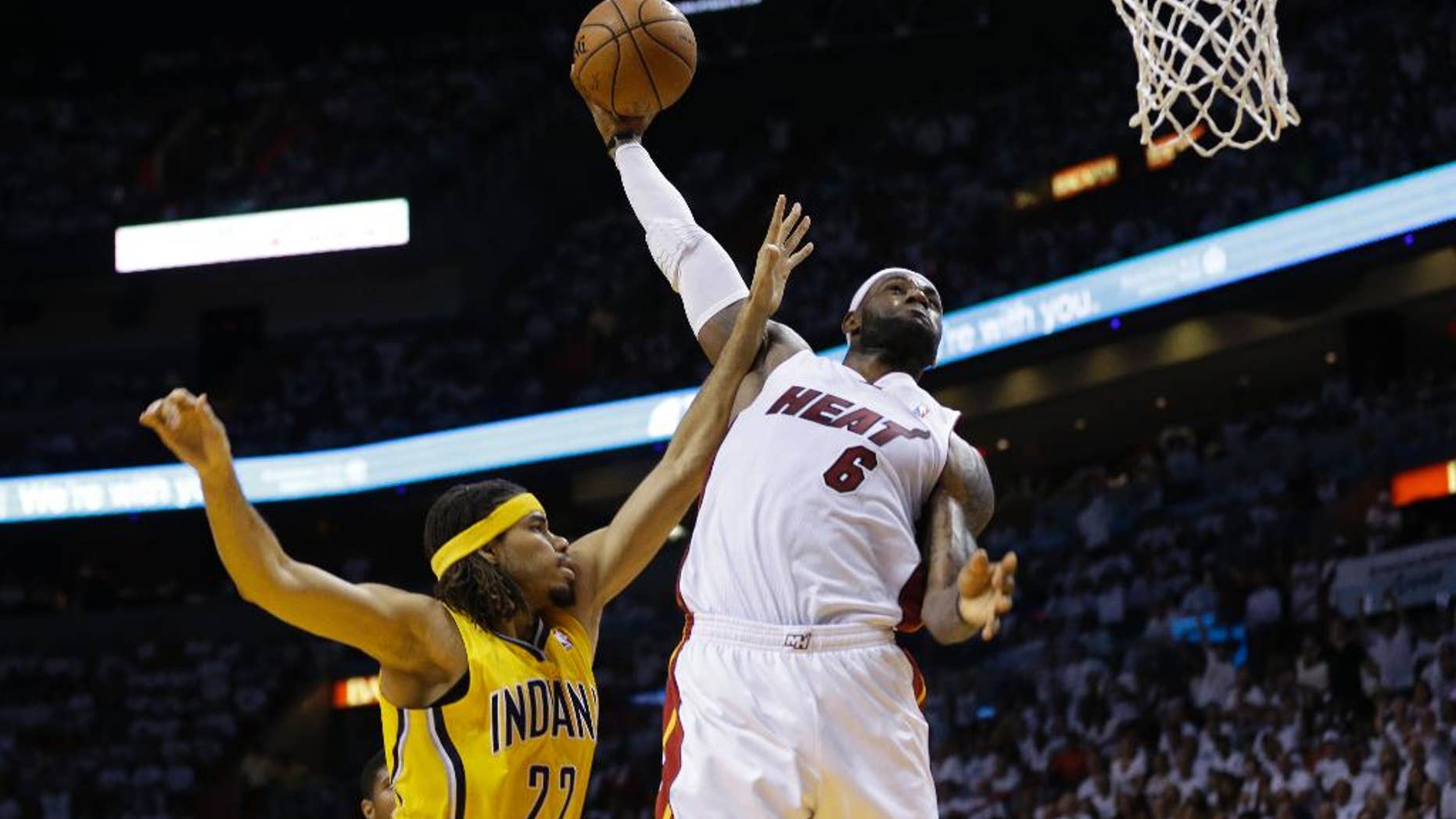 Miami Heat forward LeBron James (6) drives to dunk the ball over Indiana Pacers forward Chris Copeland (22) during the second half Game 6 in the NBA basketball playoffs Eastern Conference finals on Friday, May 30, 2014, in Miami. (AP Photo/Lynne Sladky)
