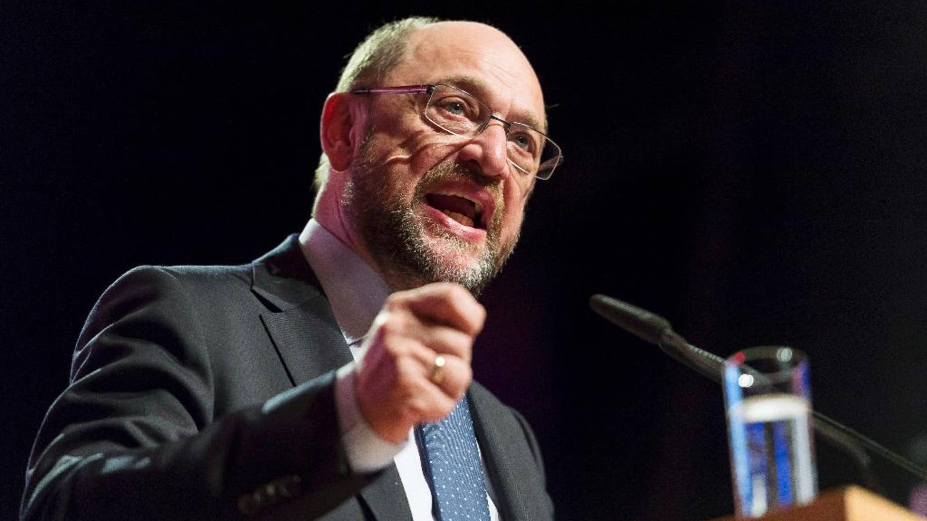 FILE - In this April 7, 2017 file photo Martin Schulz, chairman of Germany's Social Democratic, SPD, and chancellor candidate delivers a speech at the conference of the SPD youth organization in Duisburg, Germany. Chancellor Angela Merkel’s center-left challenger Schulz is promising that Germany would be a “strong and reliable” NATO member under his leadership, but questioning anew the aim of dedicating two percent of gross domestic product to defense spending. (Guido Kirchner/dpa via AP, file)