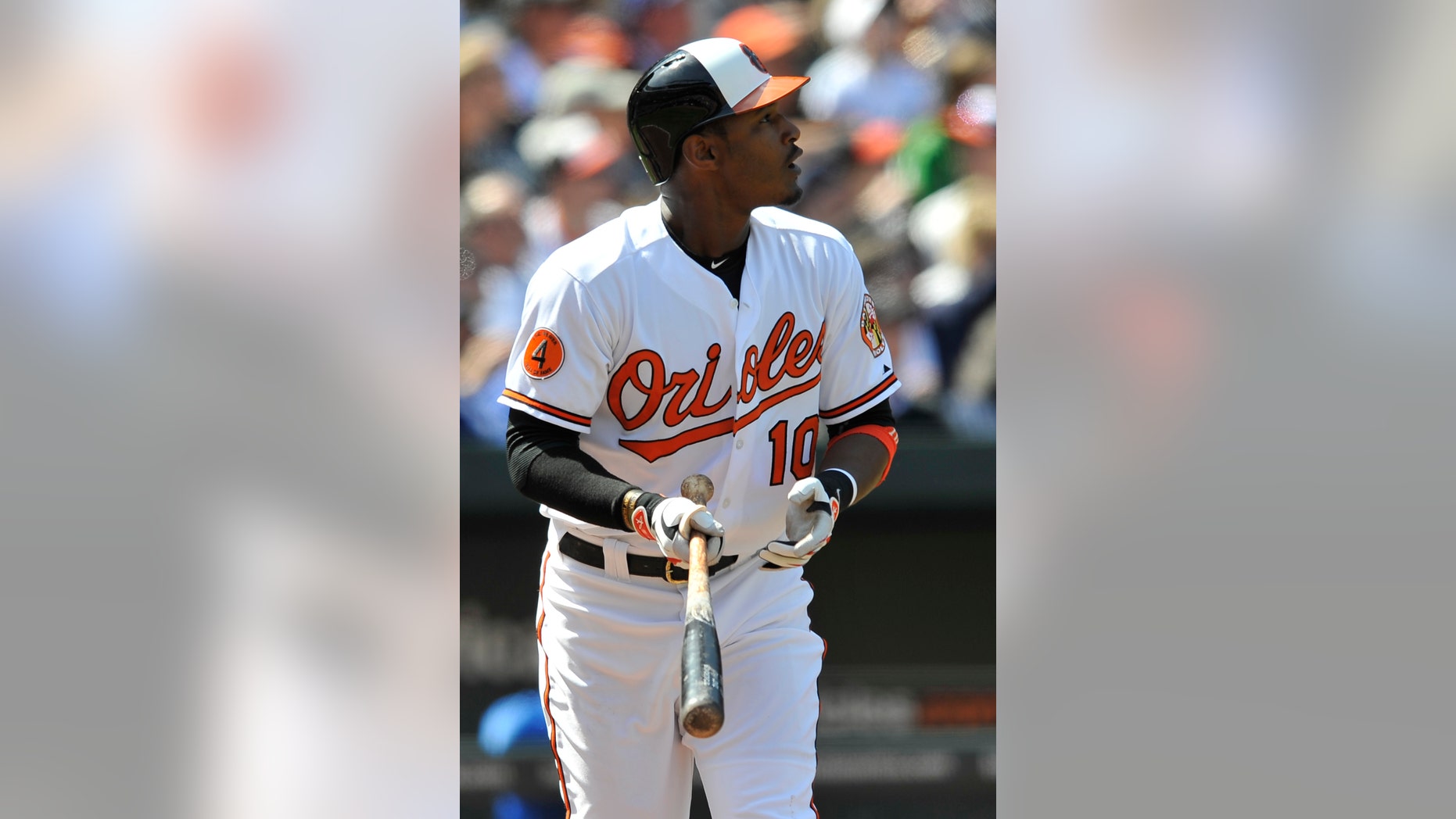 Baltimore Oriole's Adam Jones watches his solo home run leave the field against the Los Angeles Dodgers in the third inning of a baseball game Sunday, April 21, 2013 in Baltimore. (AP Photo/Gail Burton)