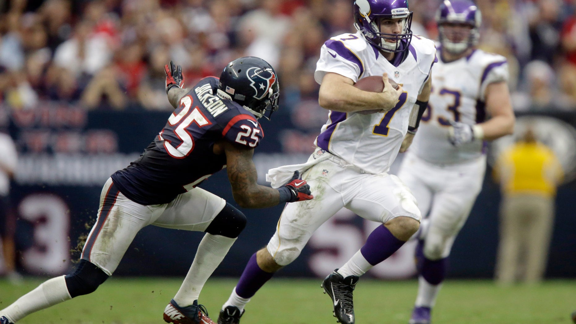 Minnesota Vikings quarterback Christian Ponder (7) runs for a first down as Houston Texans cornerback Kareem Jackson (25) defends during the fourth quarter of an NFL football game Sunday, Dec. 23, 2012, in Houston. The Vikings beat the Texans 23-6. (AP Photo/Patric Schneider)