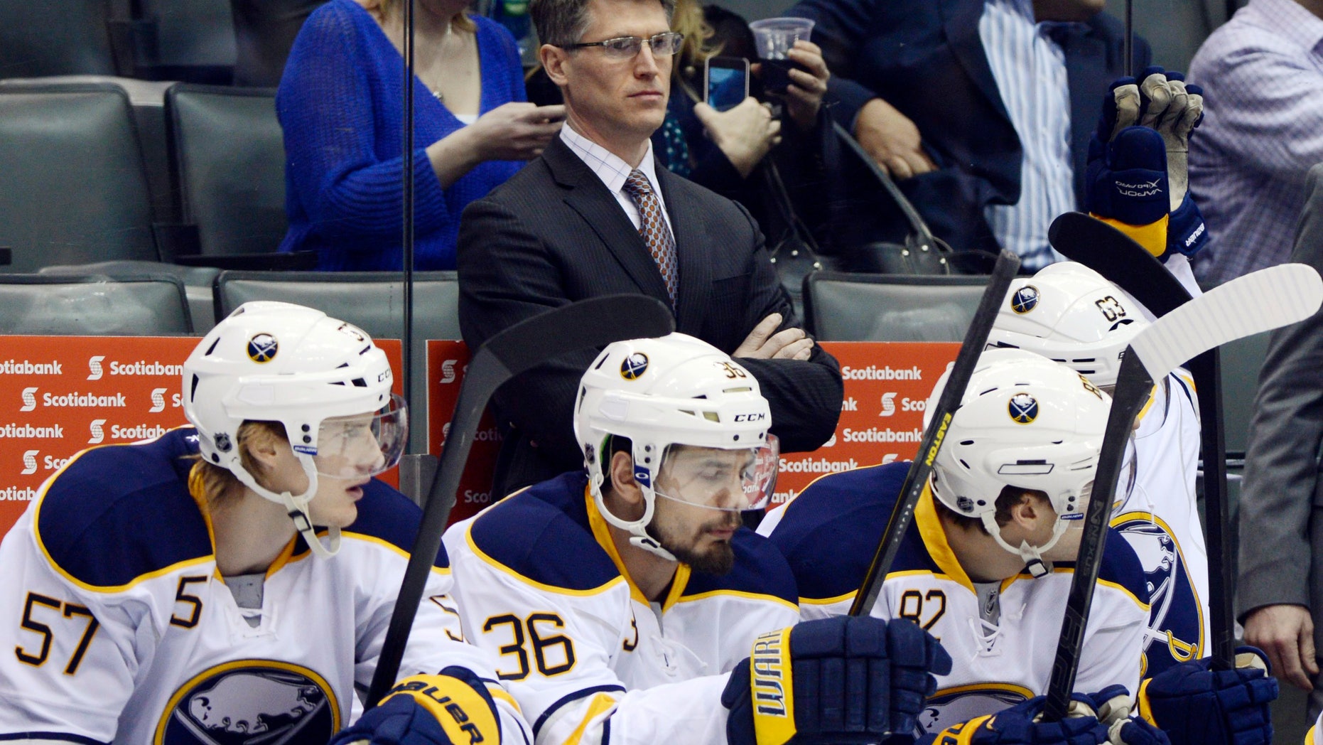 Buffalo Sabres interim head coach Ron Rolston stands behinds his players during an NHL hockey game against the Toronto Maple Leafs in Toronto, Thursday, Feb. 21, 2013. The Sabres fired head coach Lindy Ruff on Wednesday. (AP Photo/The Canadian Press, Frank Gunn)
