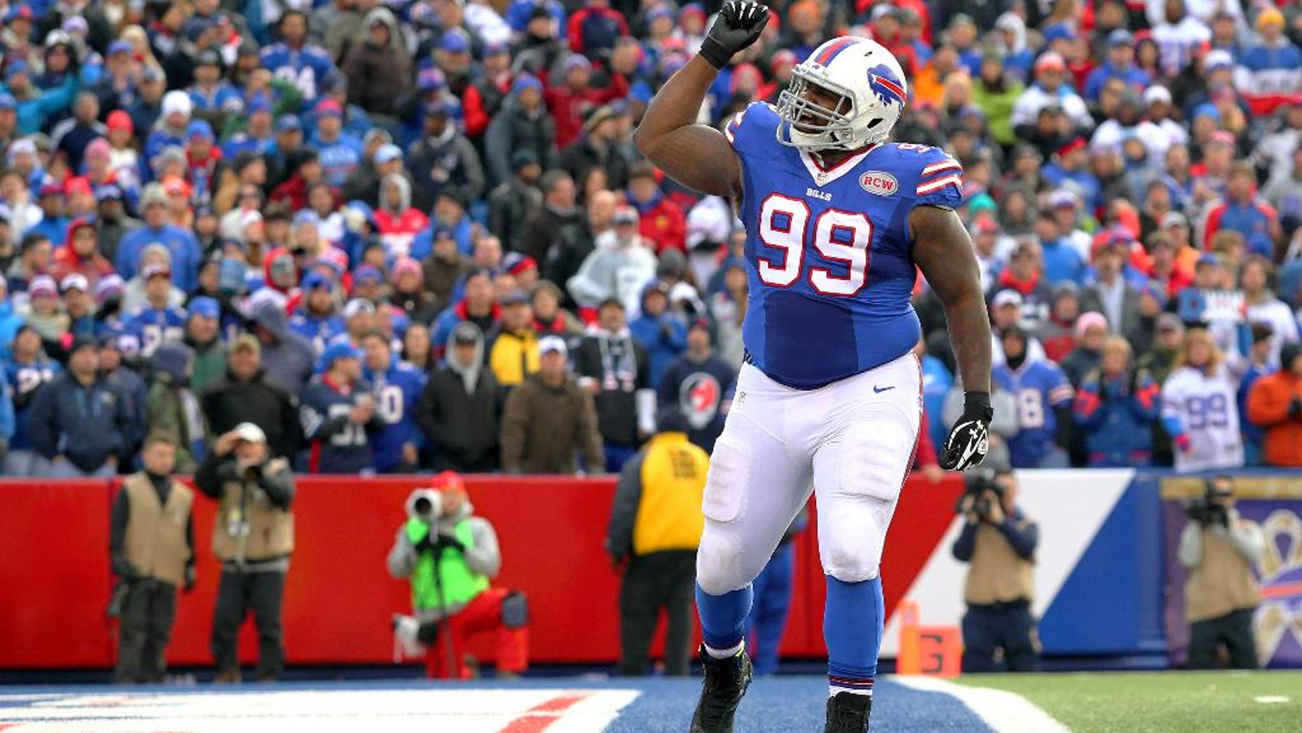 Buffalo Bills defensive tackle Marcell Dareus celebrates after sacking Kansas City Chiefs quarterback Alex Smith during the second half of an NFL football game, Sunday, Nov. 9, 2014, in Orchard Park, N.Y. (AP Photo/Bill Wippert)