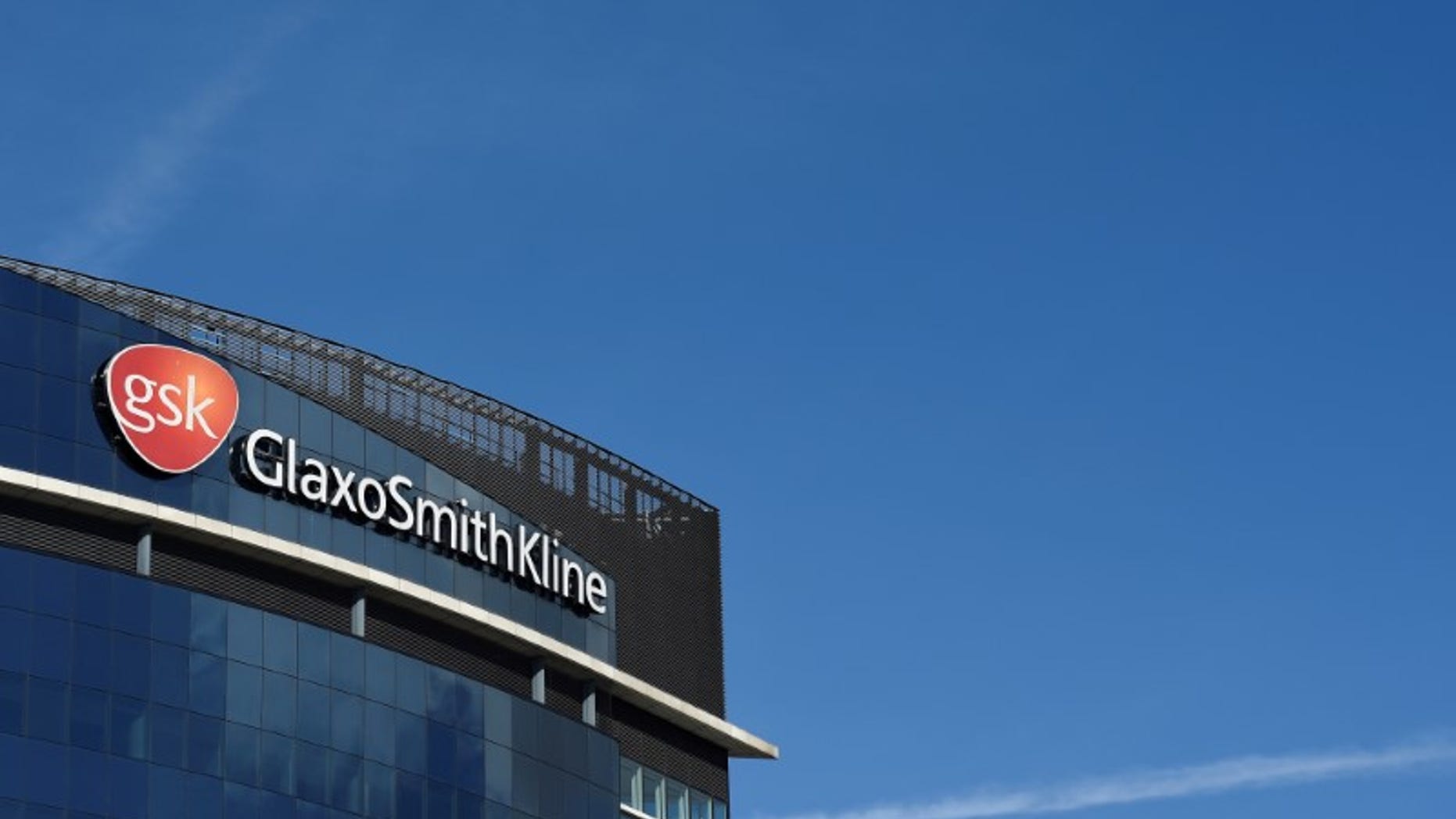 Signage for GlaxoSmithKline is seen on it's offices in London, Britain