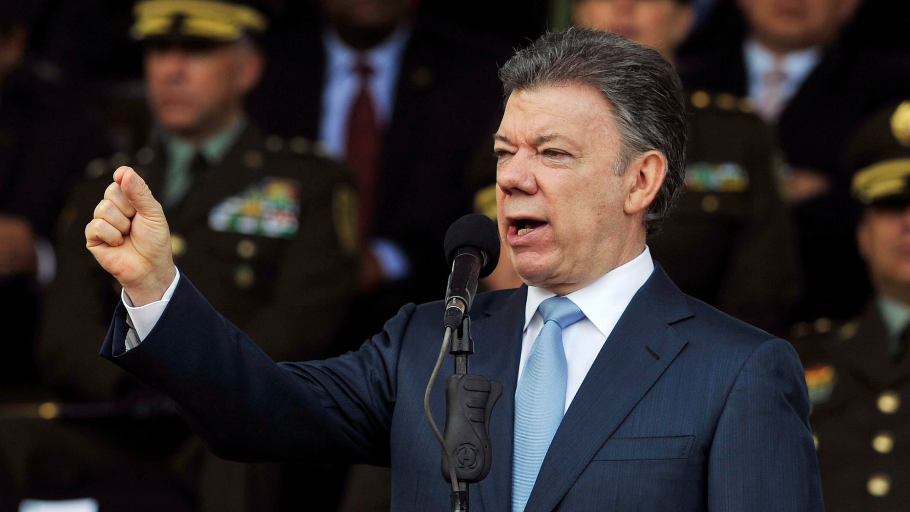 FILE - In this Nov. 6, 2013 file photo, Colombia's President Juan Manuel Santos speaks during a graduation ceremony for police cadets in Bogota, Colombia. Santos announced on Wednesday, Nov. 20, 2013 that he will run for reelection in 2014. (AP Photo/Carlos Julio Martinez, File)
