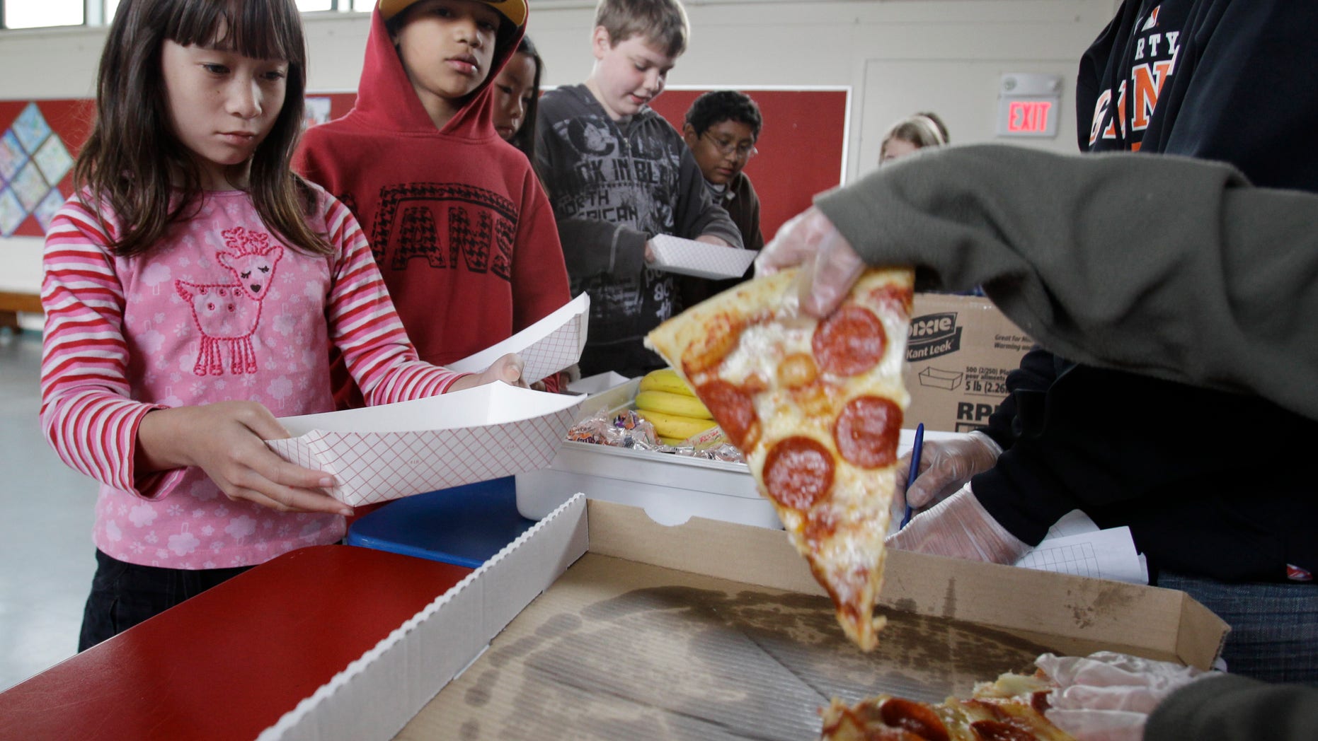 Dec. 2, 2012: A Fairmeadow Elementary School student orders pepperoni pizza during a school lunch program in Palo Alto, Calif.