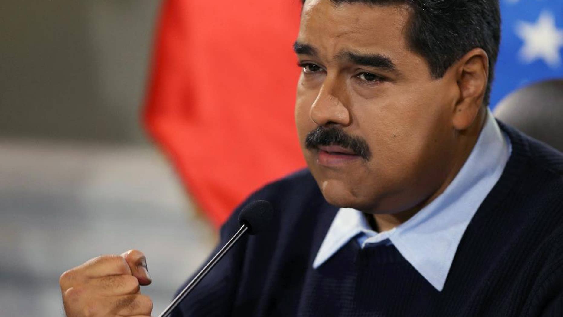 Venezuela's President Nicolas Maduro gestures during a news conference at Miraflores presidential palace in Caracas, Venezuela, Monday, Aug. 24, 2015. Venezuelan security forces have deported hundreds of Colombians as part of a security offensive along the border that is ratcheting up tensions between the two neighbors.(AP Photo/Fernando Llano)