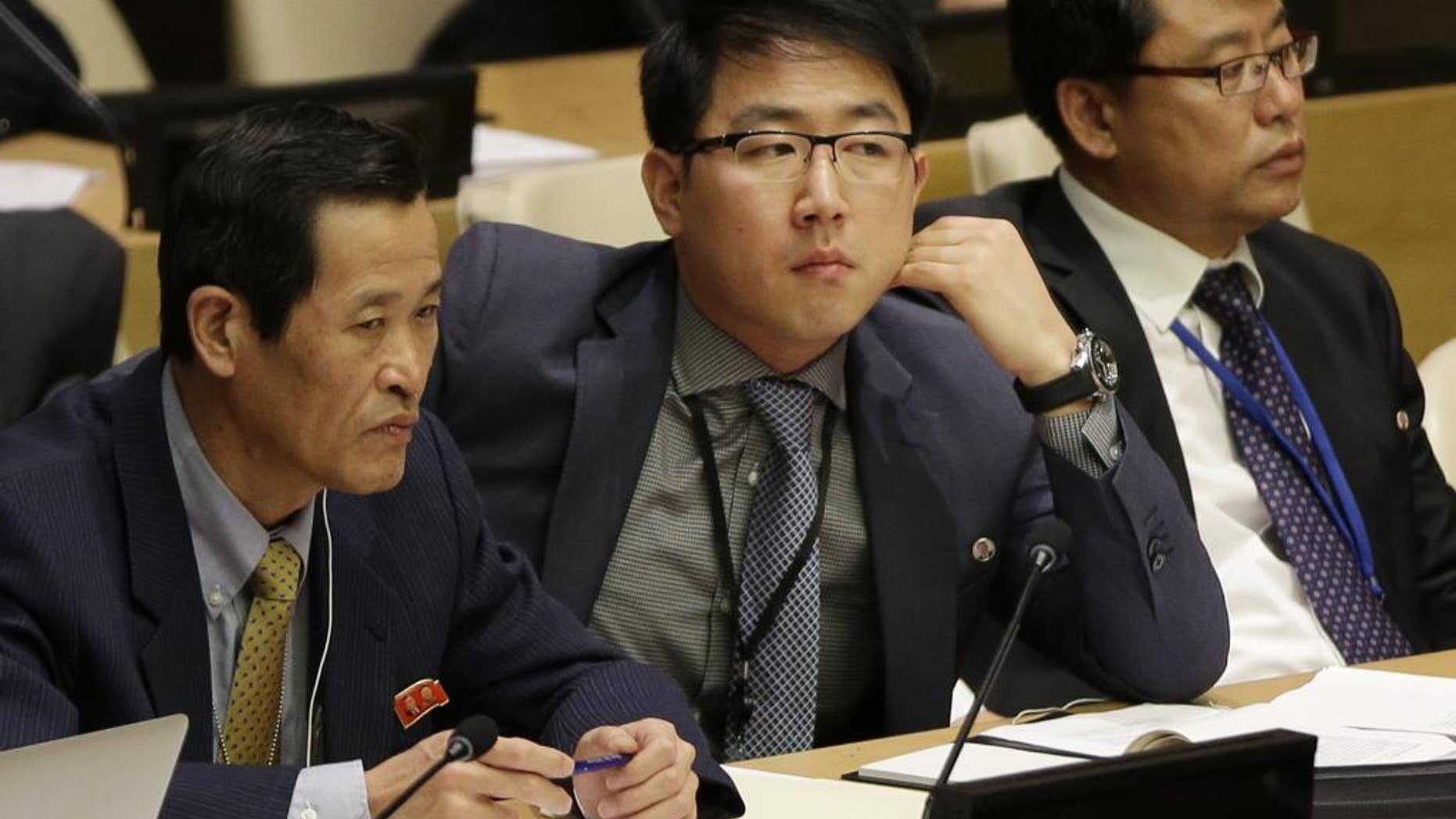 Kim Ju Song, a member of the North Korea delegation, attends a panel discussion on human rights abuses in North Korea at United Nations headquarters, Wednesday, Oct. 22, 2014. (AP Photo/Seth Wenig)