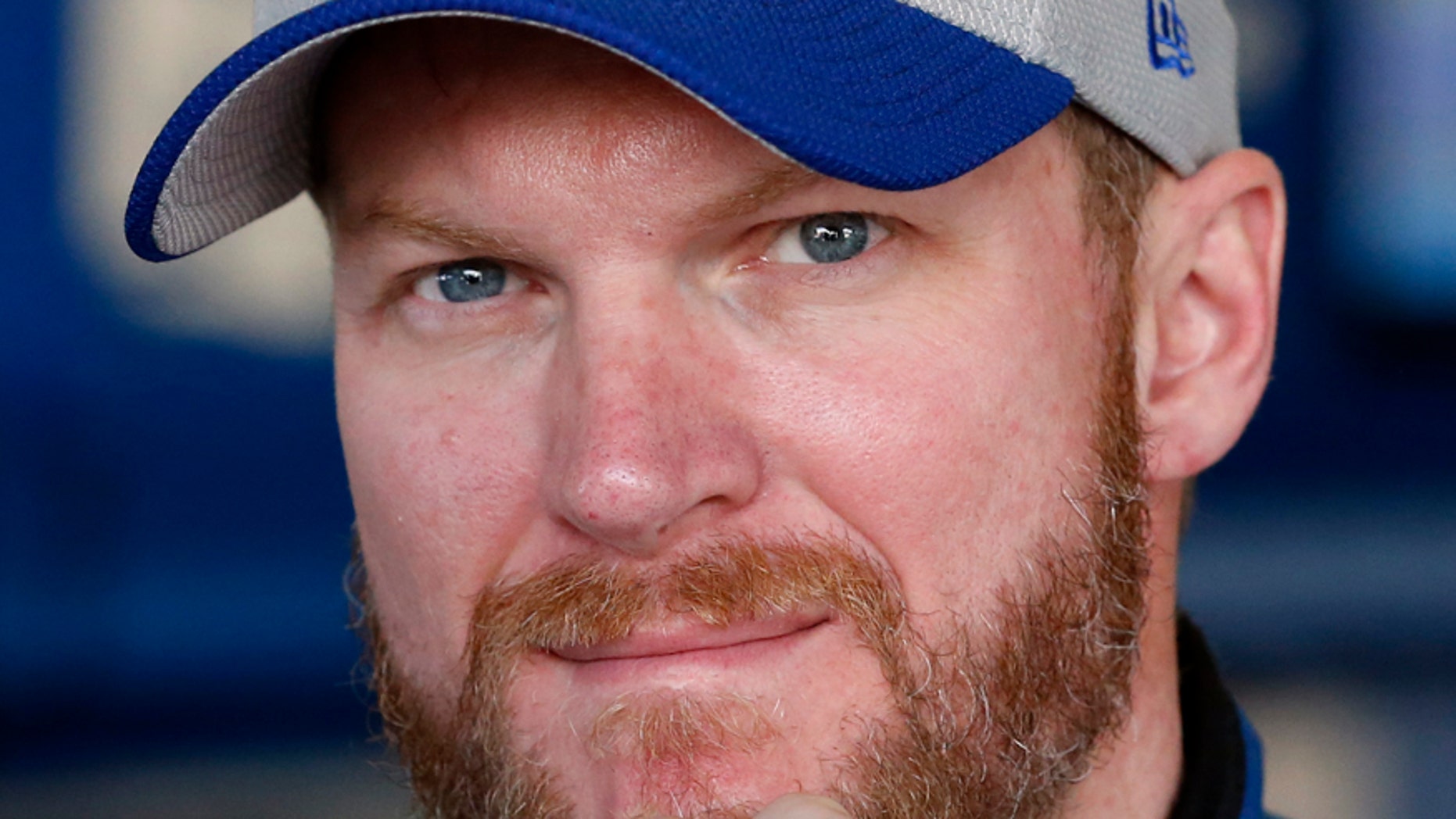 FILE - In this Feb. 20, 2016, file photo, Dale Earnhardt Jr. is shown in the garage before practice at Daytona International Speedway in Daytona Beach, Fla. Dale Earnhardt Jr. should be medically cleared from his concussion in December and ready to race in the 2017 Daytona 500. Team owner Rick Hendrick said Earnhardt recently sent a text that said he was just waiting for Daytona. (AP Photo/Wilfredo Lee, File)