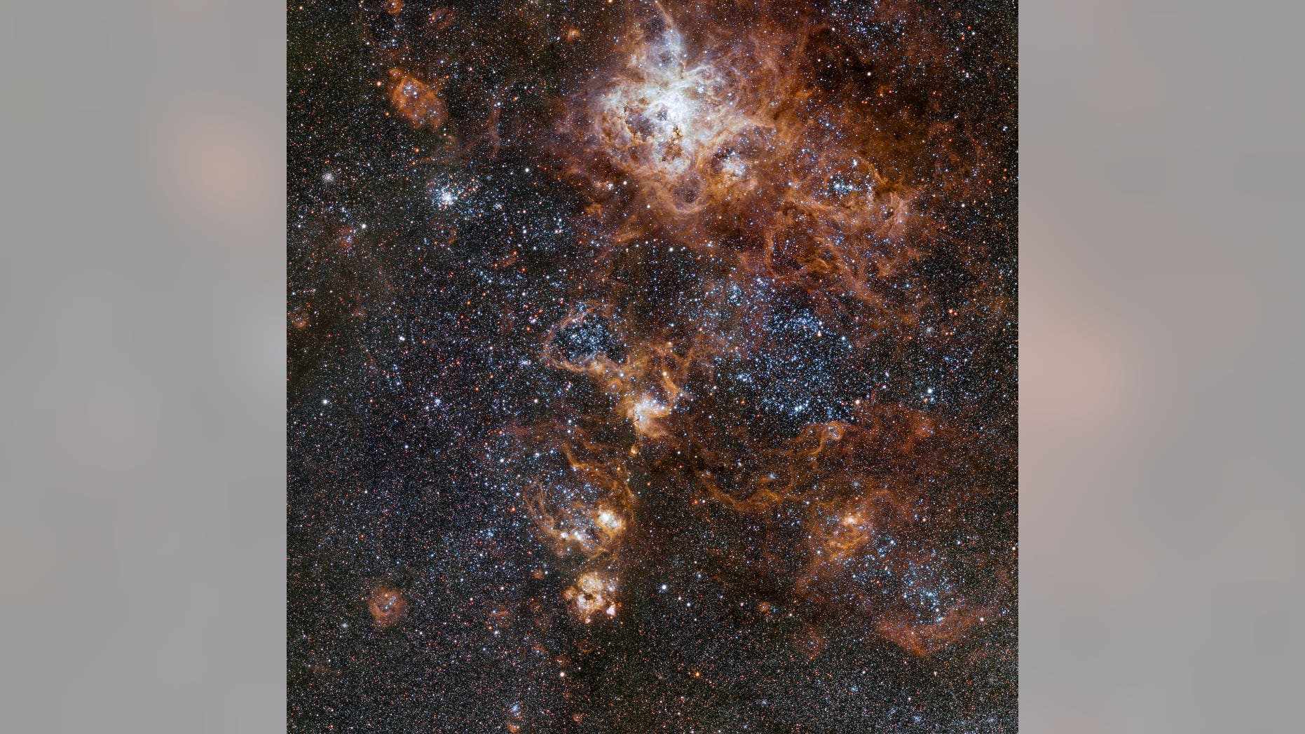 This image from VLT Survey Telescope at ESO'S Paranal Observatory in Chile showcases the brilliant Tarantula Nebula in the Large Magellanic Cloud.