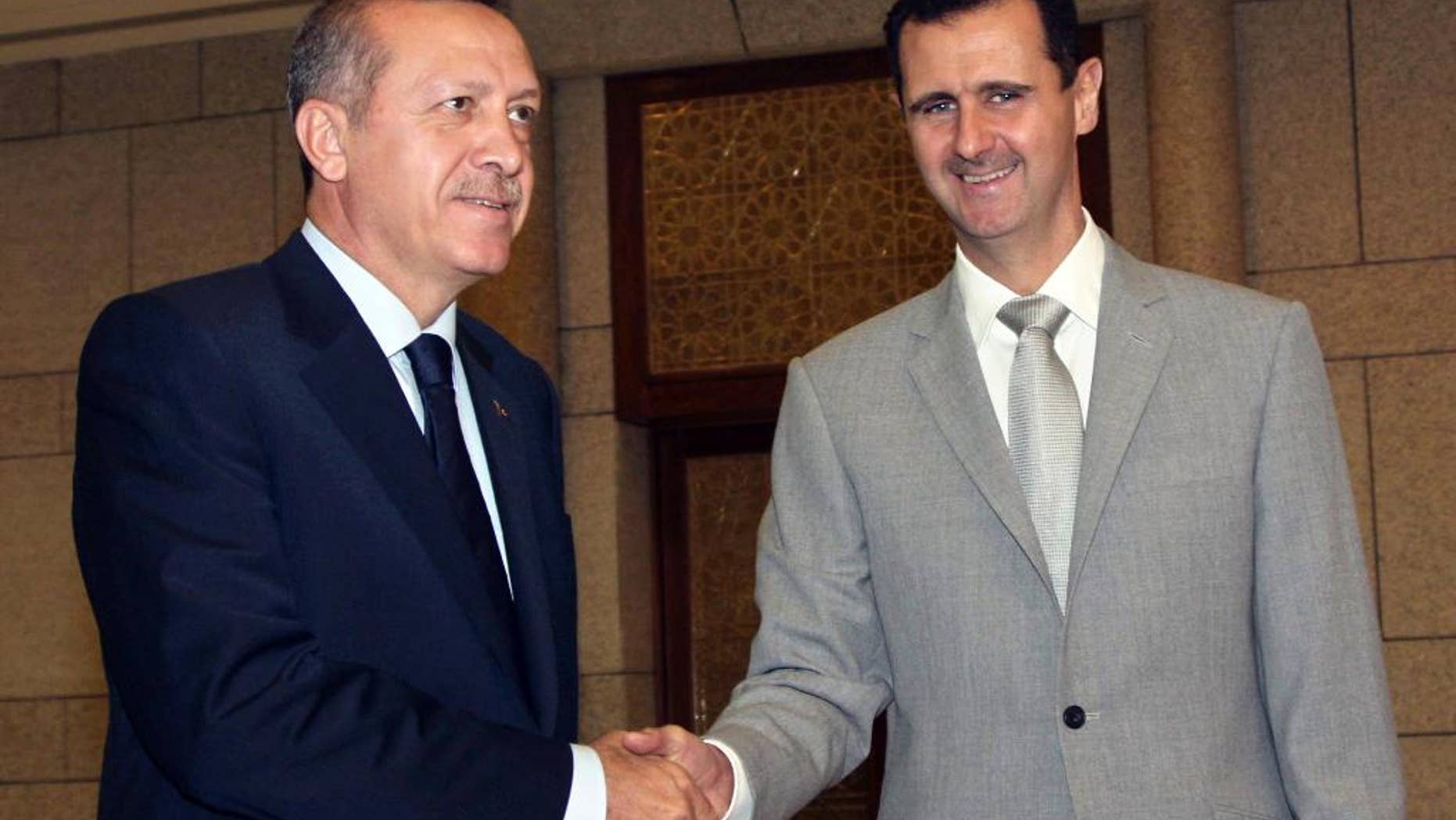 Syrian President Bashar Assad, right, shaking hands with Turkey's then-Prime Minister Recep Tayyip Erdogan in 2010.