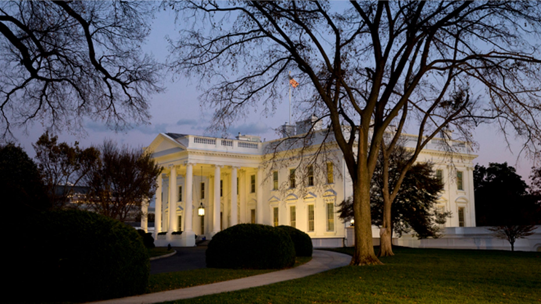 FILE - This Nov. 20, 2014, file photo shows the White House at sunset in Washington. After taking a shellacking in the November midterm elections, many Democrats remain confident that the 2016 presidential landscape still tilts in their favor. Republicans, meanwhile, are out to disprove the idea of an enduring âObama coalition.â (AP Photo/Jacquelyn Martin, File)