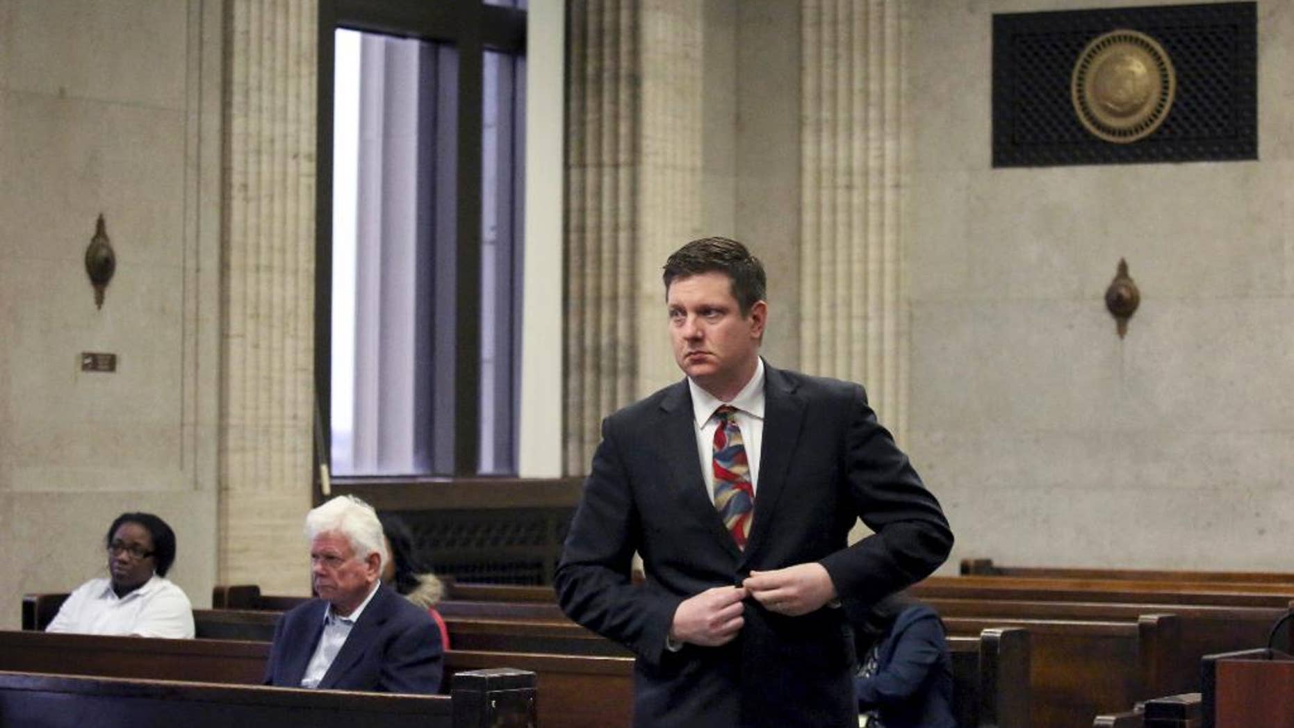 Chicago Police Officer Jason Van Dyke approaches the bench for his hearing with Judge Vincent Gaughan at the Leighton Criminal Courts Building in Chicago Tuesday Jan. 10, 2017, in Chicago. Van Dyke is charged with murder in the October 2014 death of Laquan McDonald, who was shot 16 times. The Cook County judge on Tuesday ordered the release of McDonald's juvenile records, except for records about his birth mother and sister. (Nancy Stone/Chicago Tribune via AP, Pool)