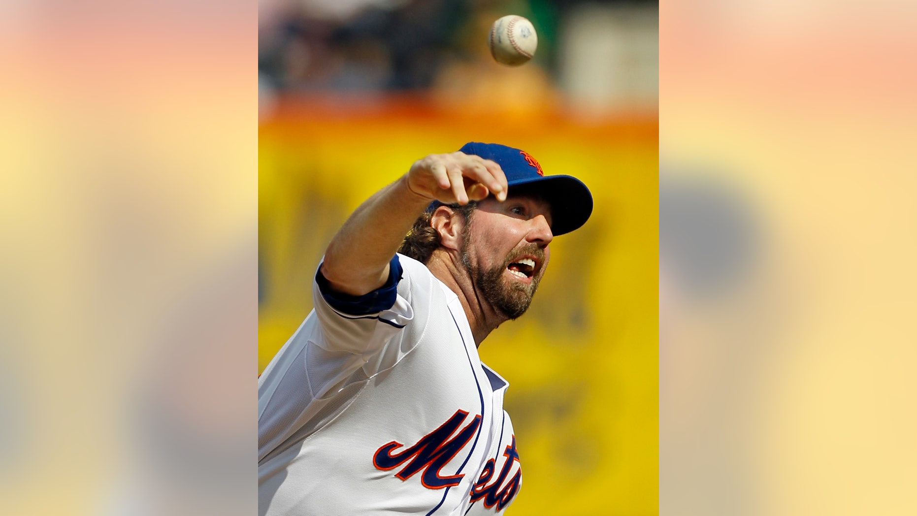 FILE - In this Sept. 27, 2012, file photo, New York Mets starting pitcher R.A. Dickey delivers against the Pittsburgh Pirates during the first inning of a baseball game at Citi Field in New York. Dickey and Mets general manager Sandy Alderson can agree on one thing _ they would prefer to have closure before opening day. The Cy Young Award winner can become a free agent after the 2013 season and says he won't negotiate once it starts, so the Mets probably have to sign him to an extension or trade him to get the best return. (AP Photo/Kathy Willens, File)