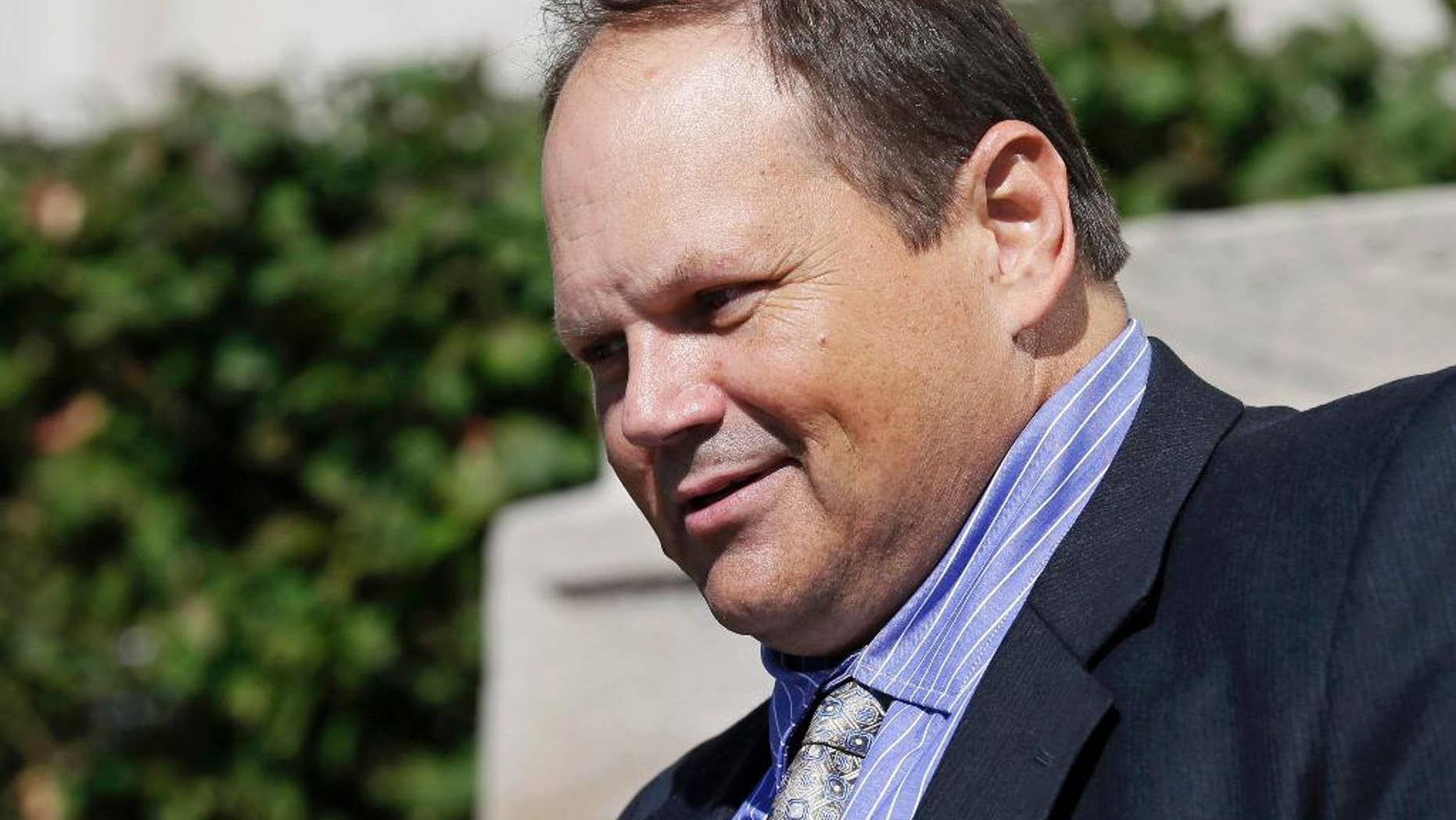 FILE - In this Sept. 9, 2015, file photo, former Multi-State Lottery Association security director Eddie Tipton leaves the Polk County Courthouse in Des Moines, Iowa, after his sentencing in a jackpot-fixing scandal. A judge says the winner of a Hot Lotto jackpot can continue a lawsuit that contends he would have won millions more if the prior drawing had not been rigged by a lottery vendor. Judge Karen Romano has rejected requests to dismiss the case, which is the first filed against the Multi-State Lottery Association over a jackpot-rigging scandal inside the organization. (AP Photo/Charlie Neibergall, File)