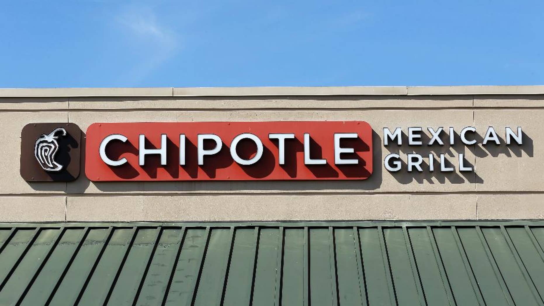 This Monday, Feb. 8, 2016, photo shows the sign over a Chipotle Mexican Grill in Brandon, Fla. The Chipotle marketing executive leading the chain's efforts to rebound after an E. coli outbreak was arrested Tuesday, July 5, 2016, on multiple counts of cocaine possession. (AP Photo/Chris O'Meara)