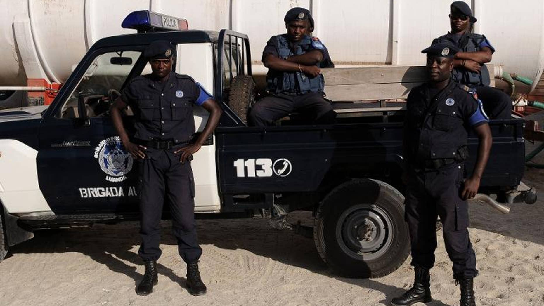 Angolan police officers stand guard in Luanda on January 16, 2010