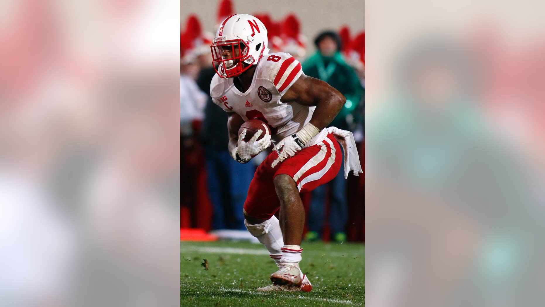 Nebraska's Ameer Abdullah runs for a 2-yard touchdown during the fourth quarter of an NCAA college football game against Michigan State, Saturday, Oct. 4, 2014, in East Lansing, Mich. Michigan State won 27-22. (AP Photo/Al Goldis)