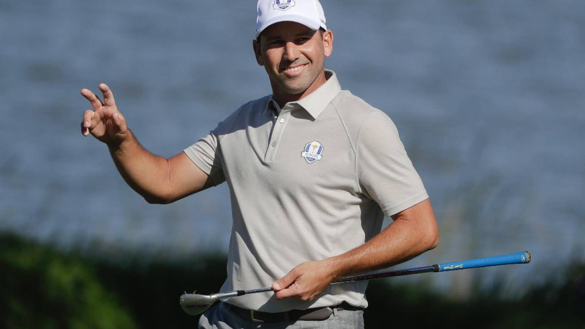 FILE- In this Saturday, Oct. 1, 2016 file photo, Spanish golfer Sergio Garcia reacts after making a birdie on the seventh hole during a four-ball match at the Ryder Cup golf tournament, at Hazeltine National Golf Club in Chaska, Minn. For more than 200 days, Garcia was the subject of a relentless Twitter campaign from one of his big fans. Mark Johnson, an Englishman, just wanted one thing: To be Garcia’s caddie for a day. (AP Photo/Chris Carlson, File)