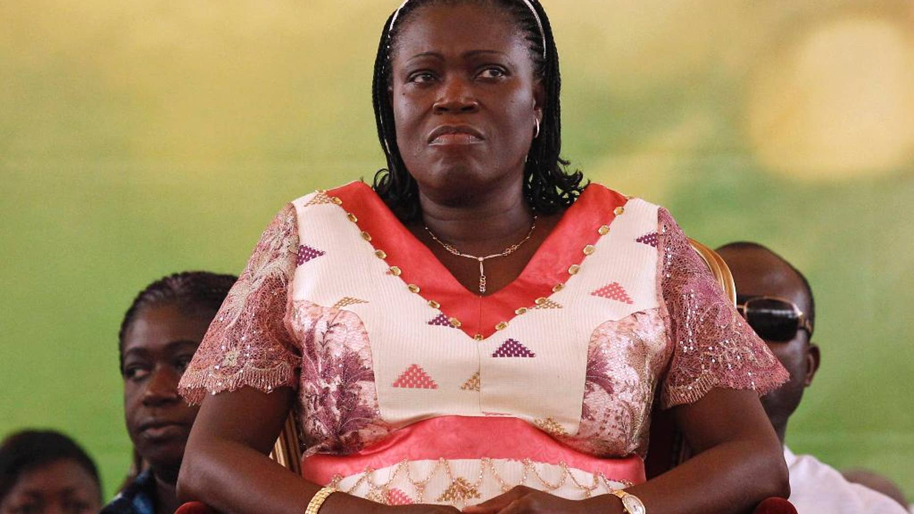 FILE - In this Jan. 15, 2011 file photo Simone Gbagbo attends a rally in support of her husband, former President Laurent Gbagbo, in Abidjan, Ivory Coast. Appeals judges at the International Criminal Court in The Hague, Netherlands ruled Wednesday, May 27, 2015 that the court can prosecute Ivory Coast’s former first lady on charges including murder and rape linked to violence that left 3,000 people dead in the aftermath of the country’s disputed 2010 presidential election. (AP Photo/Rebecca Blackwell, File)