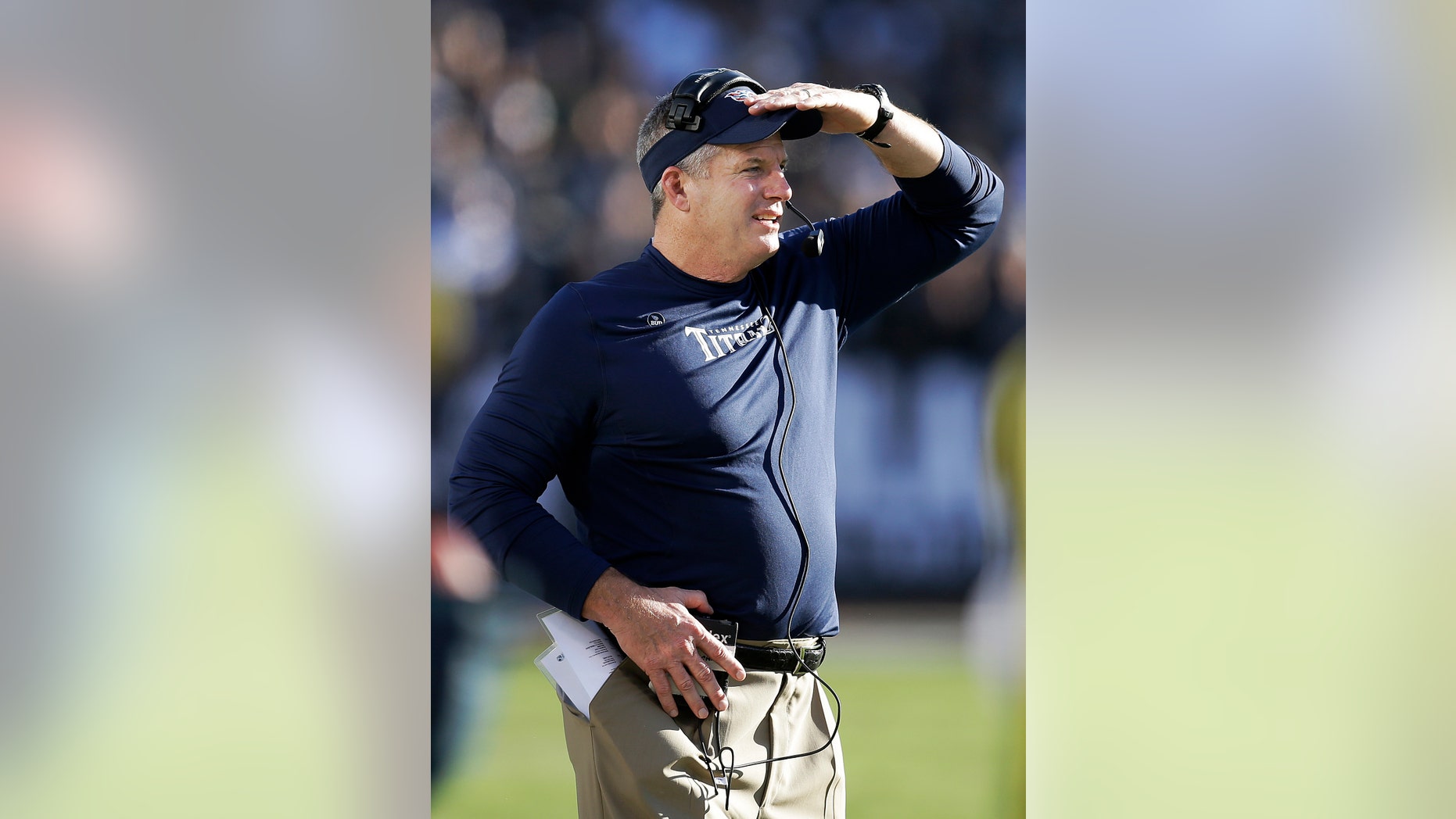 Tennessee Titans head coach Mike Munchak watches from the sideline during the second quarter of an NFL football game against the Oakland Raiders in Oakland, Calif., Sunday, Nov. 24, 2013. (AP Photo/Ben Margot)