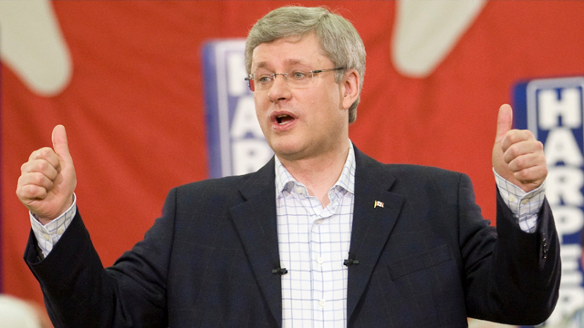 May 1: Prime Minister Stephen Harper gives a thumbs up after speaking in a campaign rally in Stratford, Prince Edward Island, Canada near Charlottetown on Sunday. Unexpected gains for the New Democratic Party have upended previous soundings that predicted the Conservatives would get enough votes to form a minority government, perhaps even a majority one. Now a new scenario has emerged in which the New Democrats and the Liberals together win enough seats to eventually form a coalition. (AP Photo/The Canadian Press