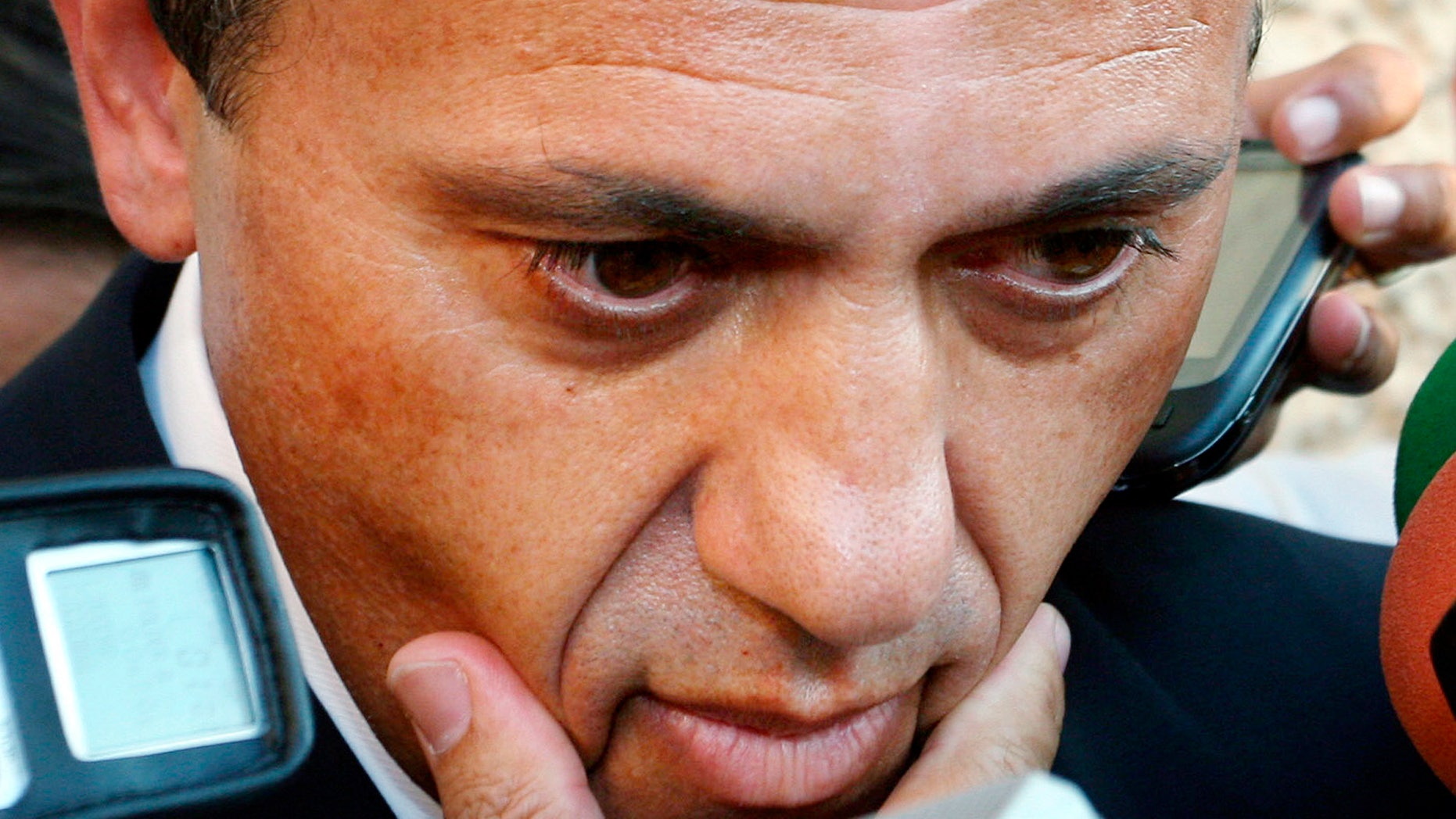 FILE - In this Aug. 28, 2007 file photo, Sevilla soccer club President, Jose Maria del Nido, speaks to the press in Athens. A Spanish court on Thursday Dec. 5, 2013 has sentenced the president of Sevilla's football club to seven years in prison for embezzlement and corruption. Madrid's Supreme Court upheld most of a 2011 ruling by a lesser court that found Jose Maria del Nido guilty of involvement in the embezzlement of public funds in the southern resort town of Marbella. The Supreme Court reduced the original sentence of 7-1/2 years by six months. (AP Photo/Miguel Angel Morenatti, File)
