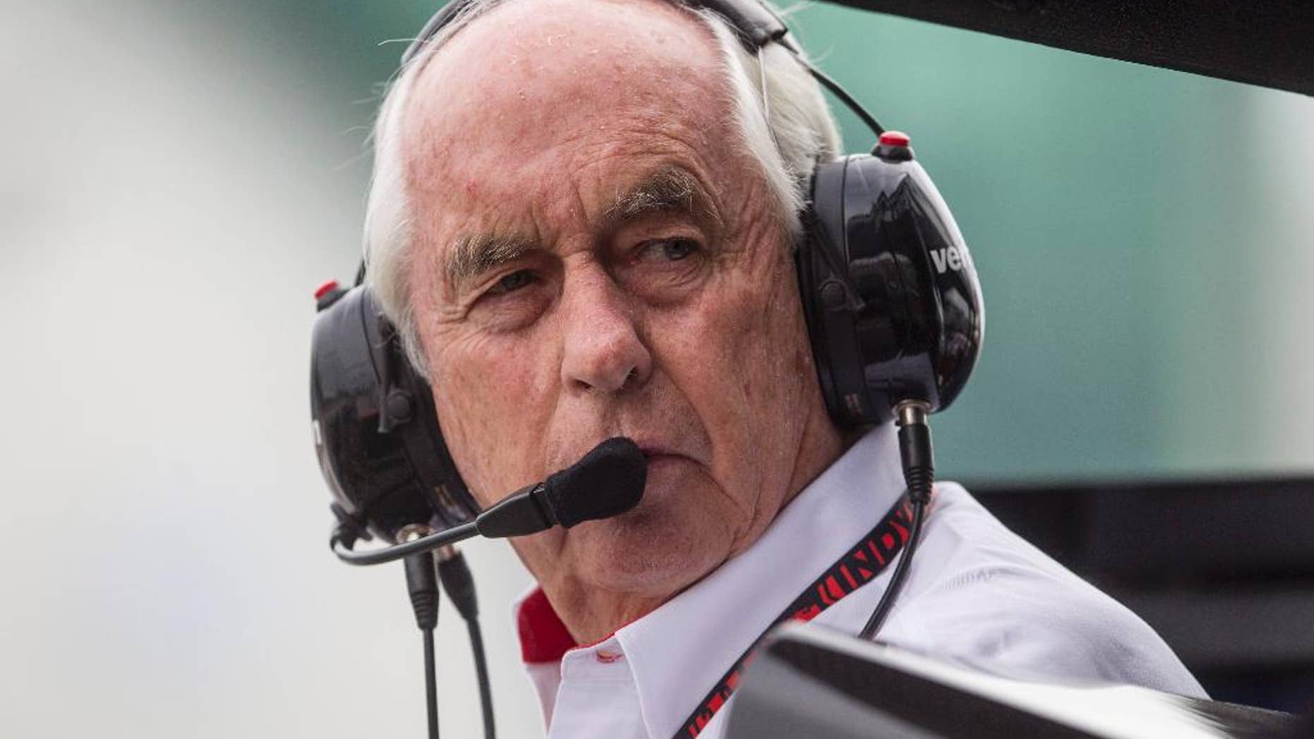 Roger Penske, owner of Team Penske, stands in the pits during a qualifying session for the IndyCar auto race in Toronto on Saturday, July 19, 2014. (AP Photo/The Canadian Press, Chris Young)