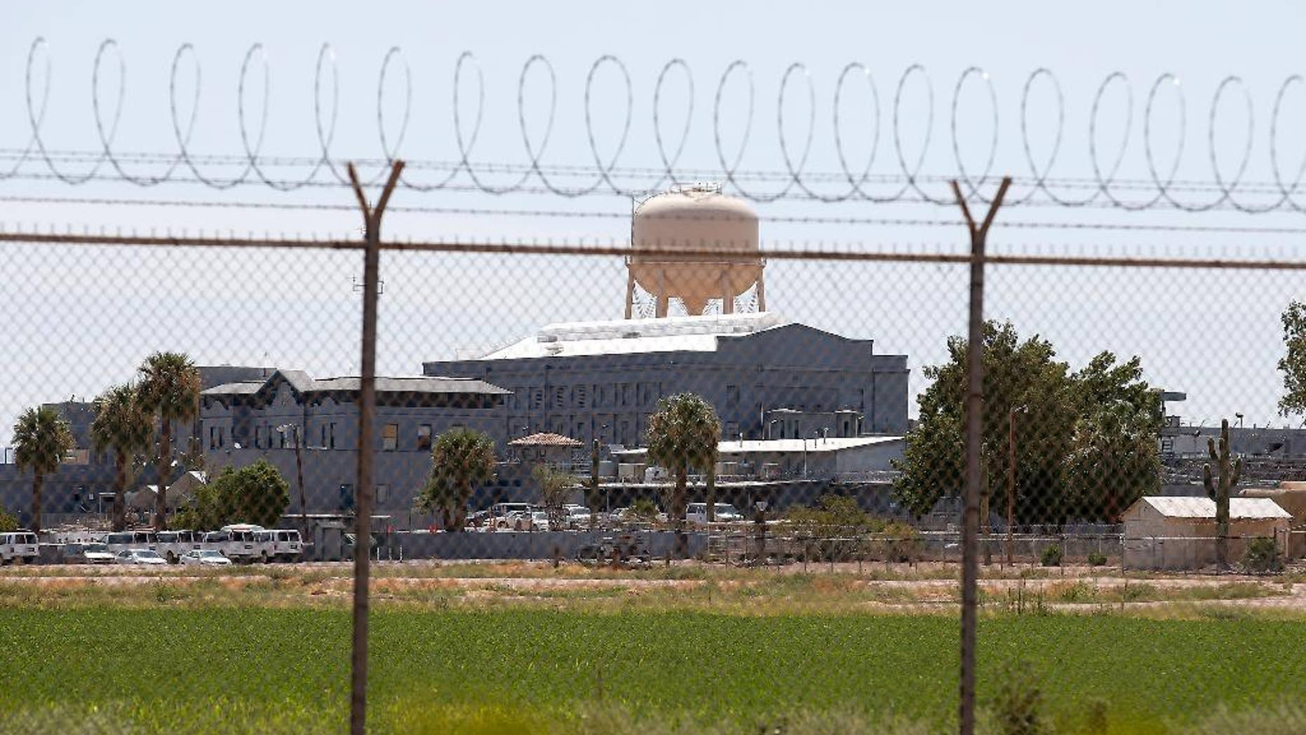 FILE - In this July 23, 2014, file photo, a fence surrounds the state prison in Florence, Ariz., where the execution of Joseph Rudolph Wood took place. (AP Photo/File)