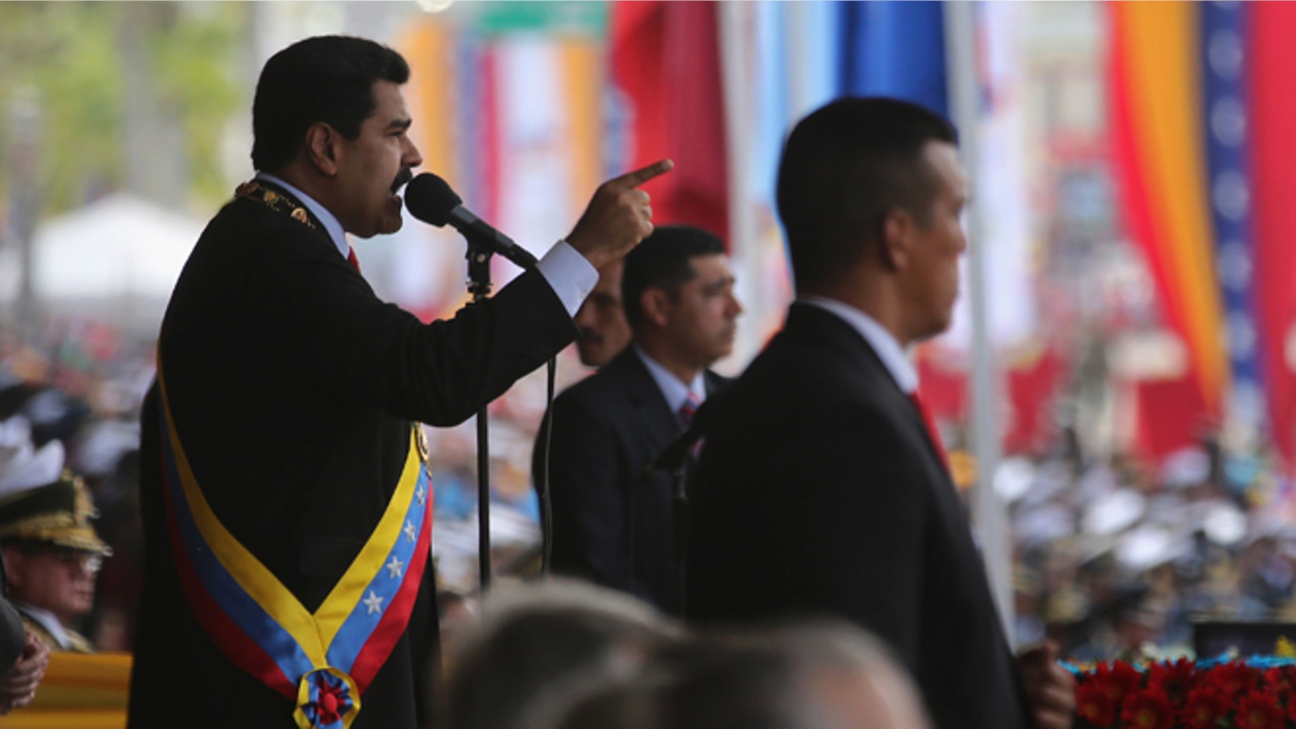 CARACAS, VENEZUELA - MARCH 05: Venezuelan President Nicolas Maduro speaks before a parade marking the first anniversary of Hugo Chavez's death on March 5, 2014 in Caracas, Venezuela. Thousands of pro-government supporters turned out to honor Chavez and listen to Maduro speak. During an anniversary speech, Maduro announed that Venezuela is cutting diplomatic and commercial relations with Panama, citing a conspiracy. (Photo by John Moore/Getty Images)