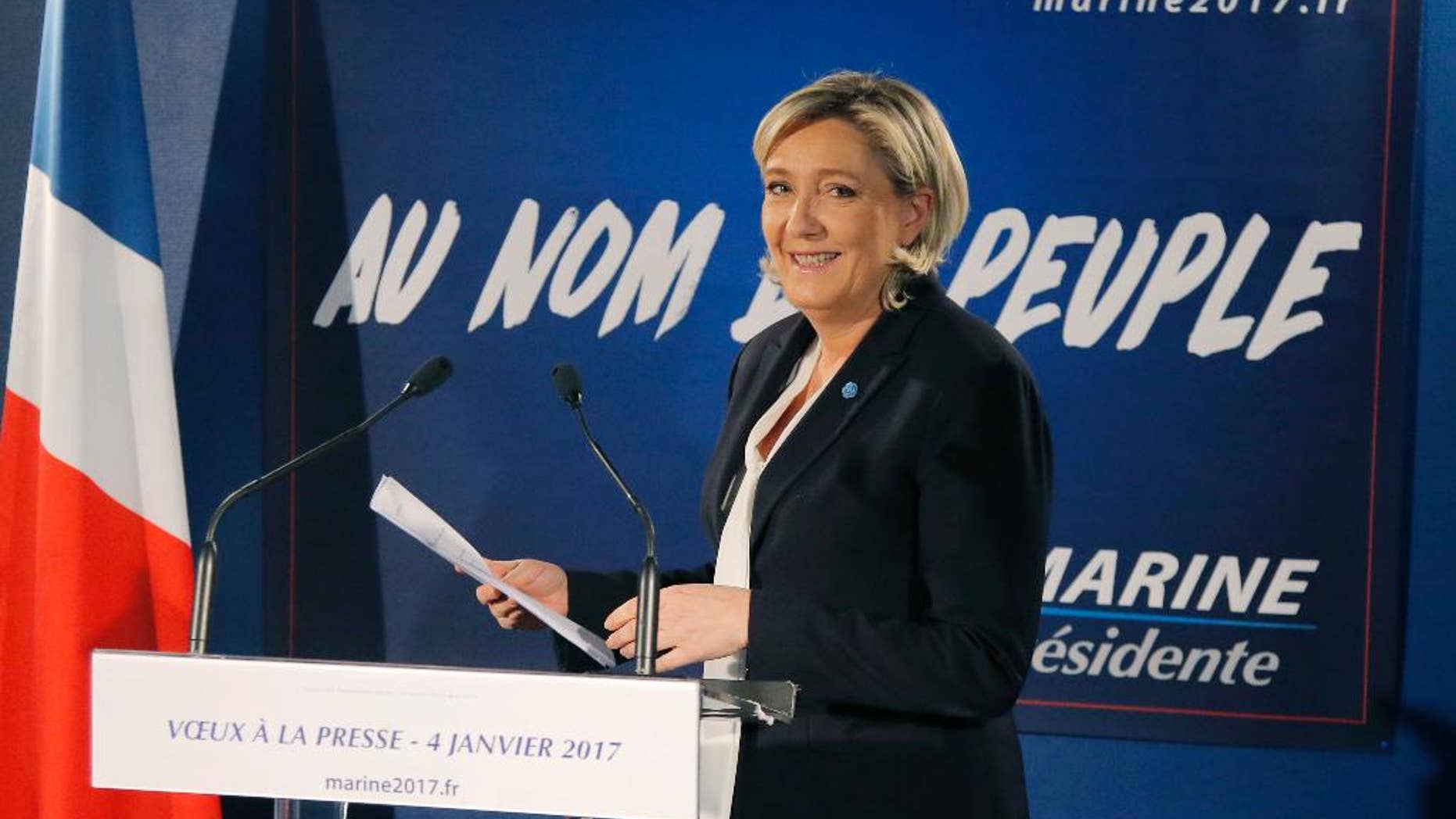 Far-right leader and candidate for next spring presidential elections Marine le Pen, arrives for her New Year's address to the media in Paris, Wednesday, Jan. 4, 2017. French far right presidential candidate Marine Le Pen is cheering Ford Motor Co.'s decision to shift investment from Mexico to the U.S., calling it a victory for the protectionist policies she champions. (AP Photo/Michel Euler)