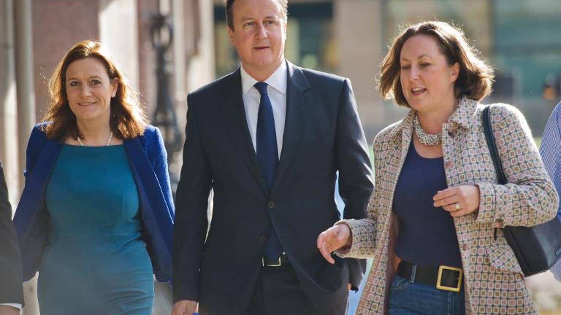 British Prime Minister David Cameron arrives at his hotel on the morning of the first day of the Conservative Party Conference in Manchester on September 29, 2013