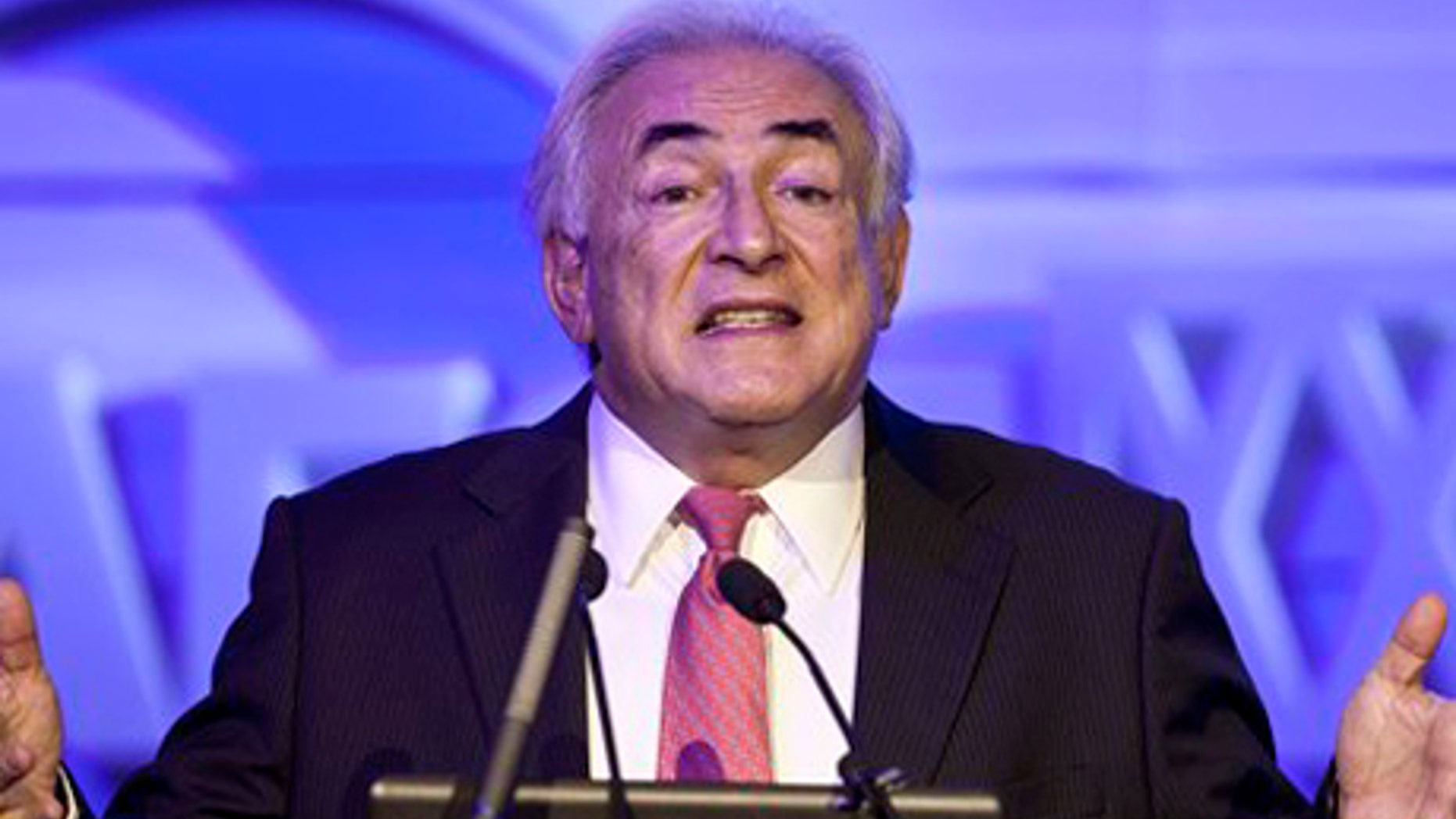 Dec. 19, 2011: Former IMF head Dominique Strauss-Kahn gestures as he speaks at an economy conference organized by Chinese Internet company Netease in Beijing, China.
