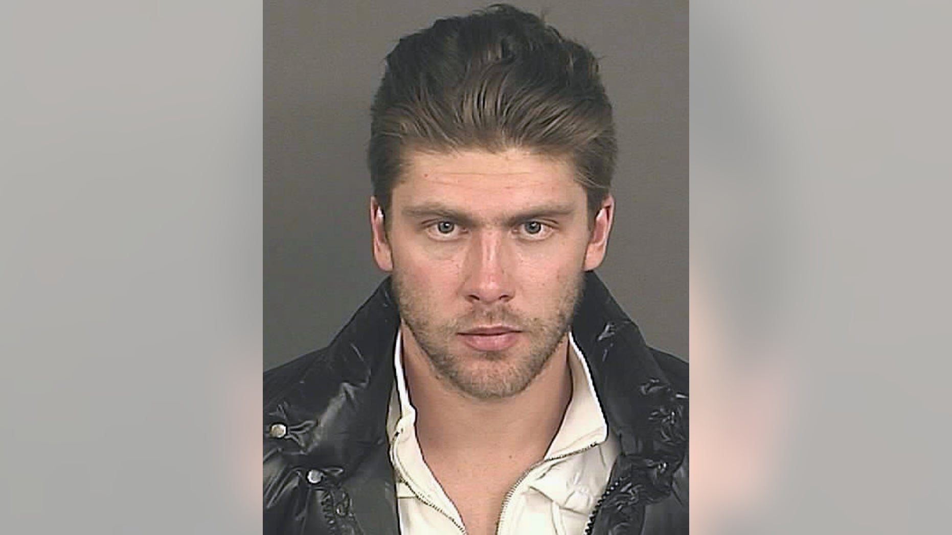 Colorado Avalanche goalie Semyon Varlamov appears in this booking photo released by the Denver Police Department. Varlamov surrendered to Denver police on an arrest warrant on charges of kidnapping and third-degree assault in what authorities are calling a domestic violence incident. Police released few details about the case Wednesday, Oct. 30, 2013, during a brief news conference. (AP Photo/Denver Police Department)